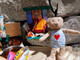 2010.4.14 珠峰营地，随身的吉祥物小熊“笨笨”在玛尼堆前留影.