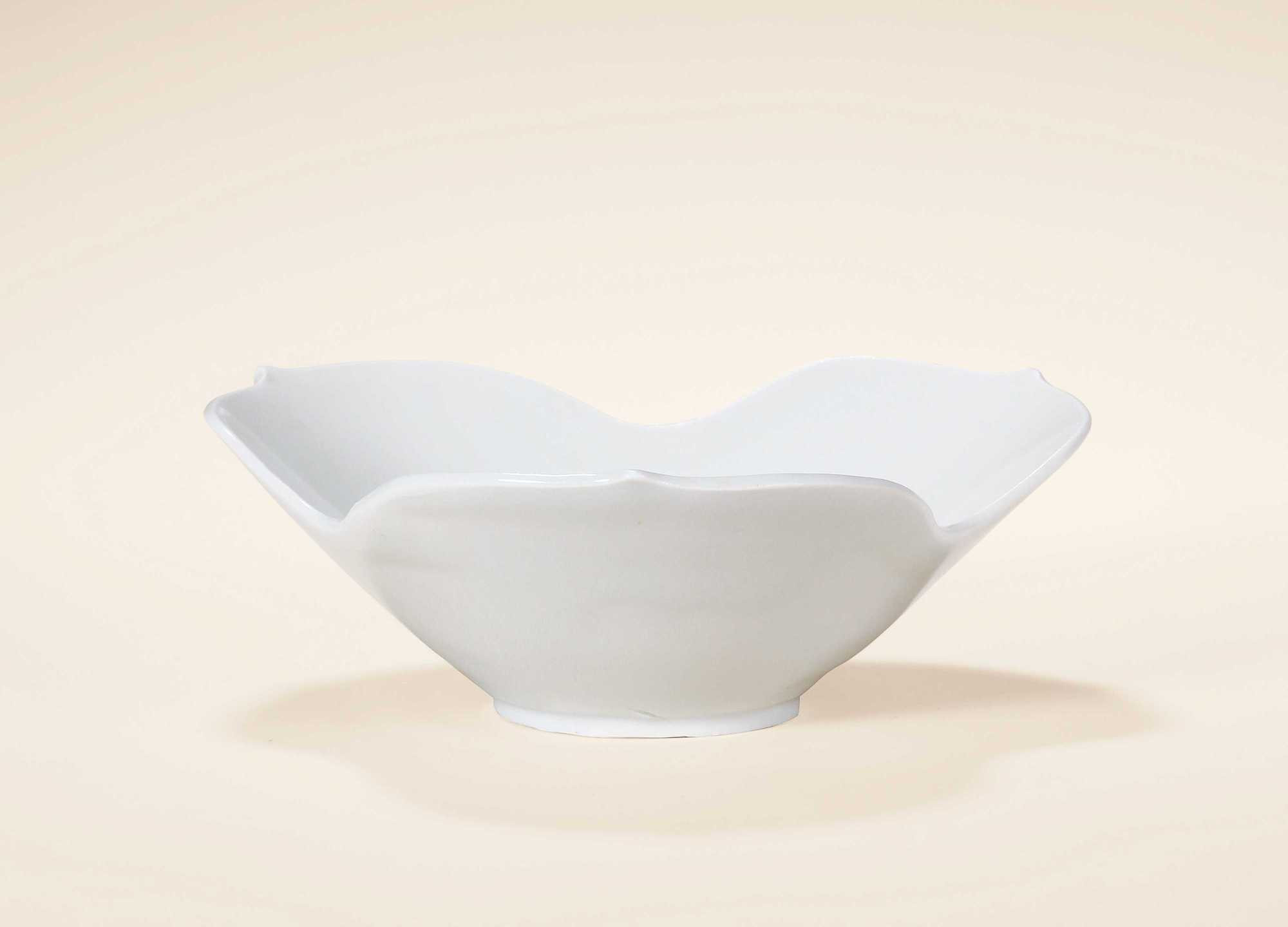 A DING WARE WHITE GLAZED FLORAL-SHAPED DISH