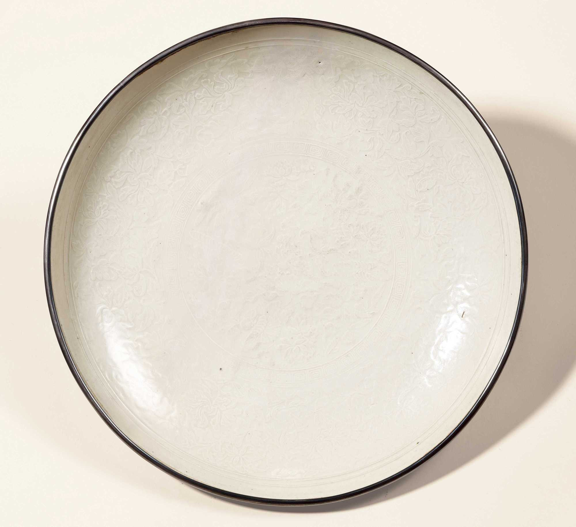A LARGE DING WARE WHITE GLAZED WITH MOUDLED PLATE