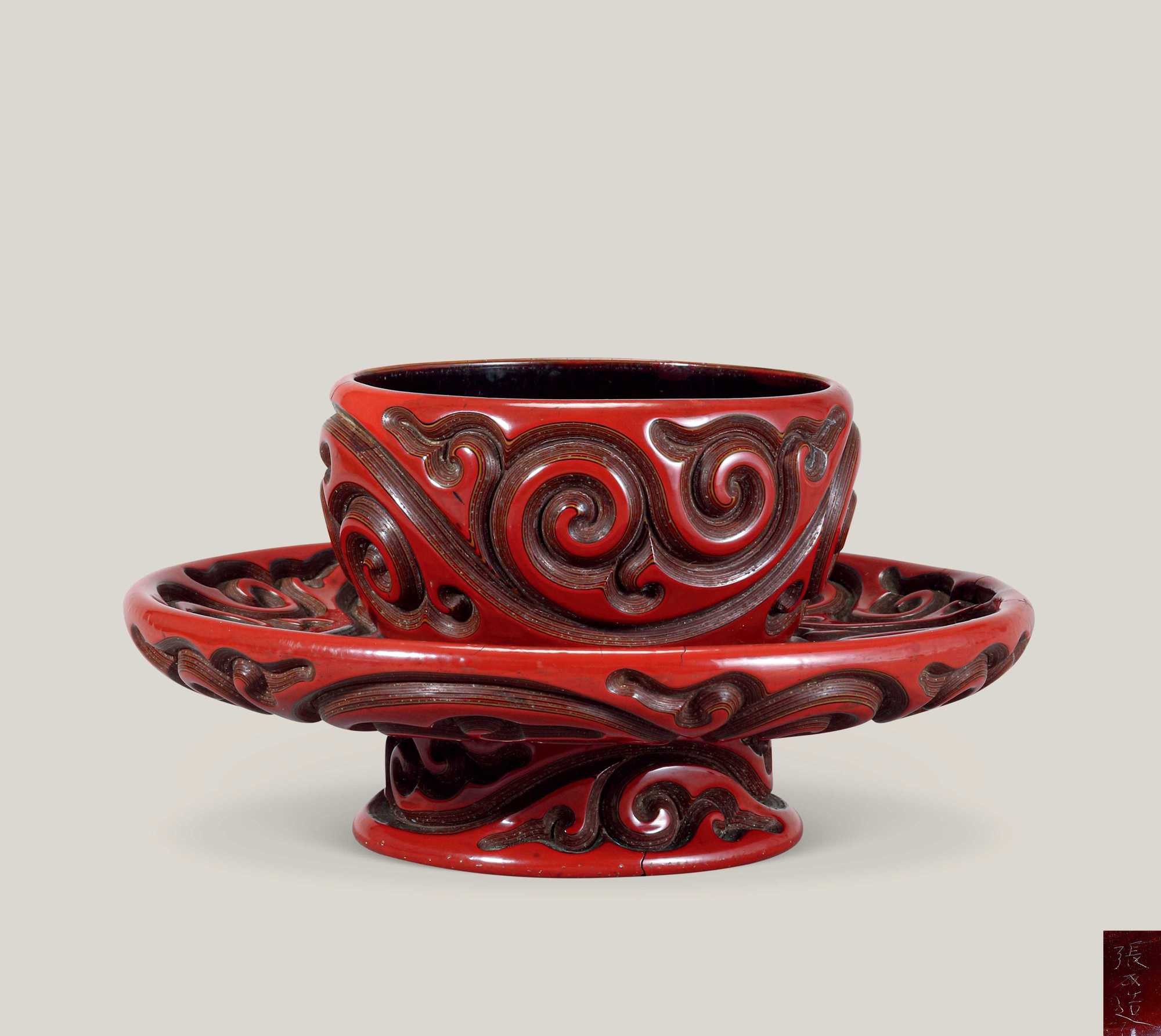 A RARE CARVED CINNABAR LACQUER CUPSTAND