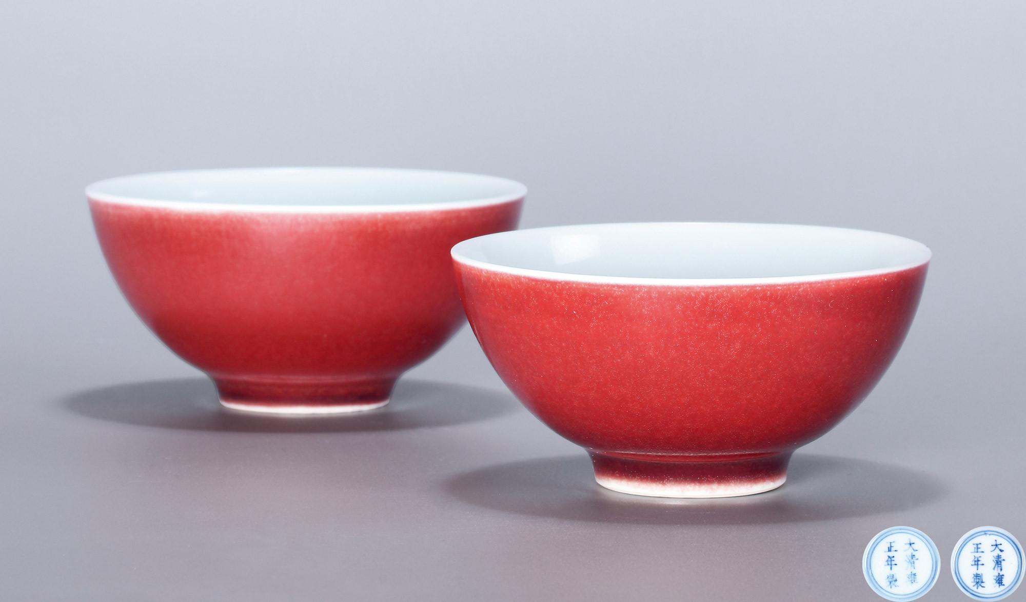 AN IMPERIAL PAIR OF COPPER-RED TEA CUPS