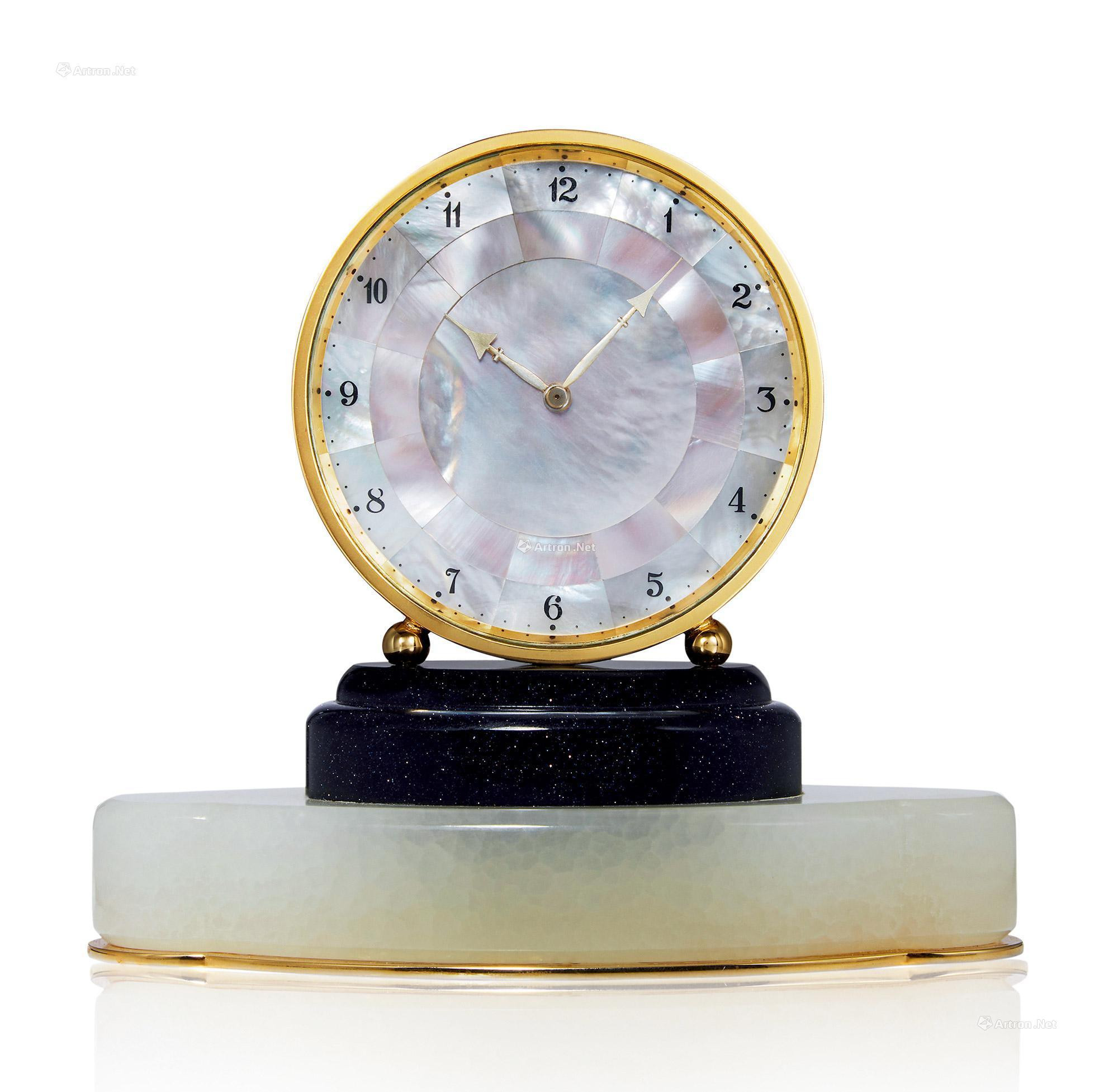 GUBELIN A BRONZE MANUALLY-WOUND TABLE CLOCK WITH MOTHER-OF-PEARL DIAL AND 8 DAYS POWER-RESERVE INDICATION