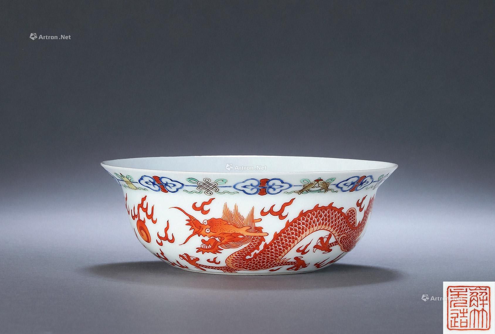 AN IRON-RED AND DRAGON-PHOENIX FAMILLE ROSE FLOWERS BOWL