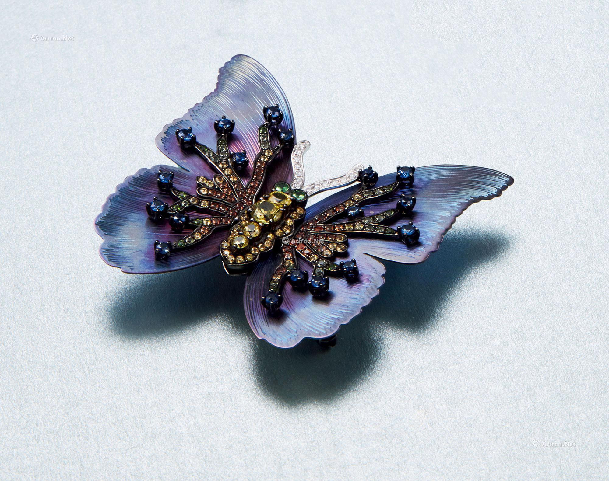 A COLORED GEM AND DIAMOND ‘BUTTERFLY’ BROOCH MOUNTED IN TITANIUM AND 18K GOLD
