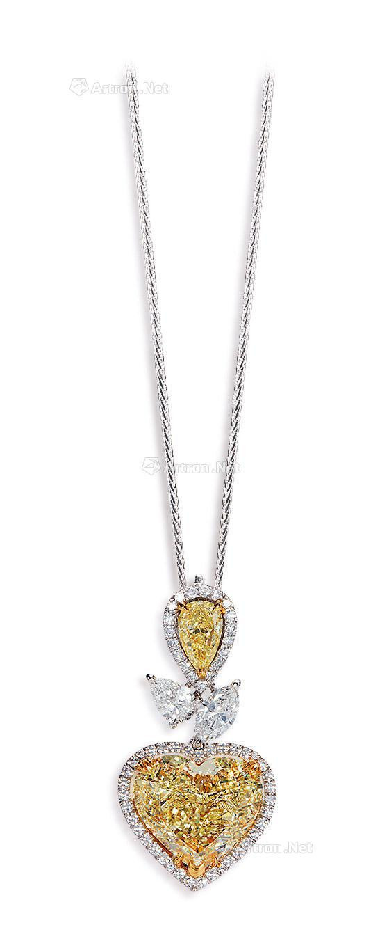 A 5.03 CARAT FANCY YELLOW DIAMOND AND DIAMOND PENDANT MOUNTED IN 18K YELLOW AND WHITE GOLD