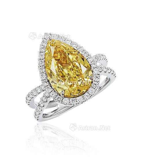 A 5 CARAT FANCY INTENSE YELLOW DIAMOND AND DIAMOND RING MOUNTED IN 18K WHITE GOLD