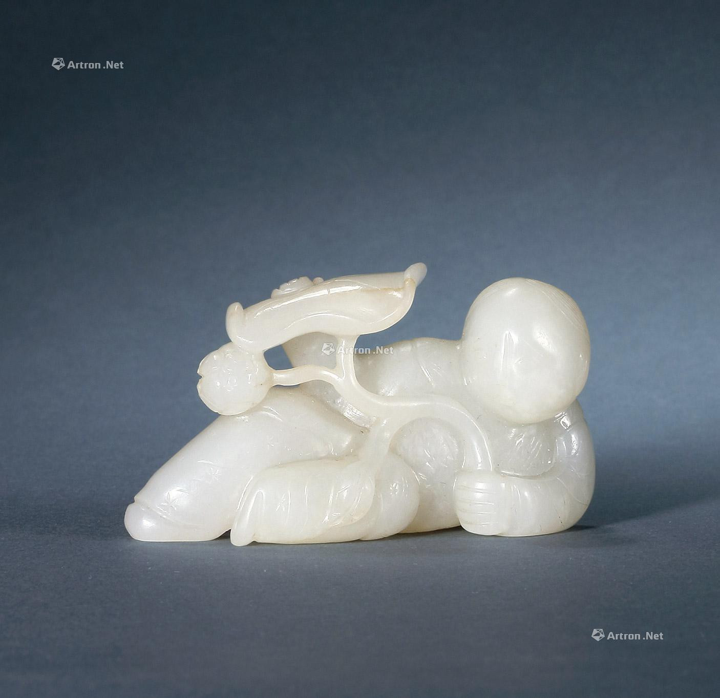 WHITE JADE CARVED BRUSHREST WITH DESIGN OF CHILD WITH LOTUS