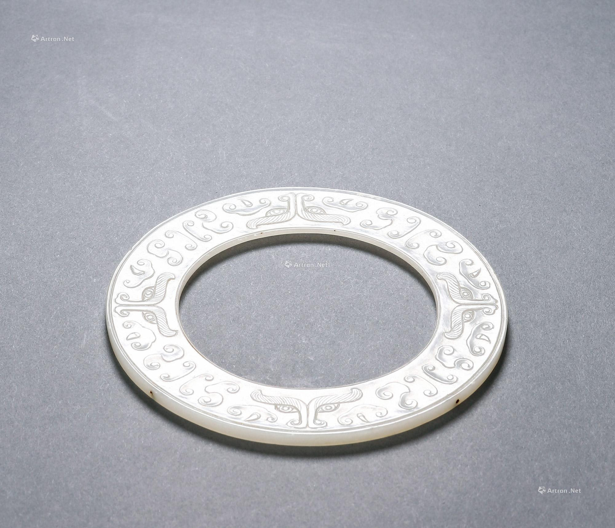 WHITE JADE CARVED BI WITH DESIGN OF BEAST AND CLOUD