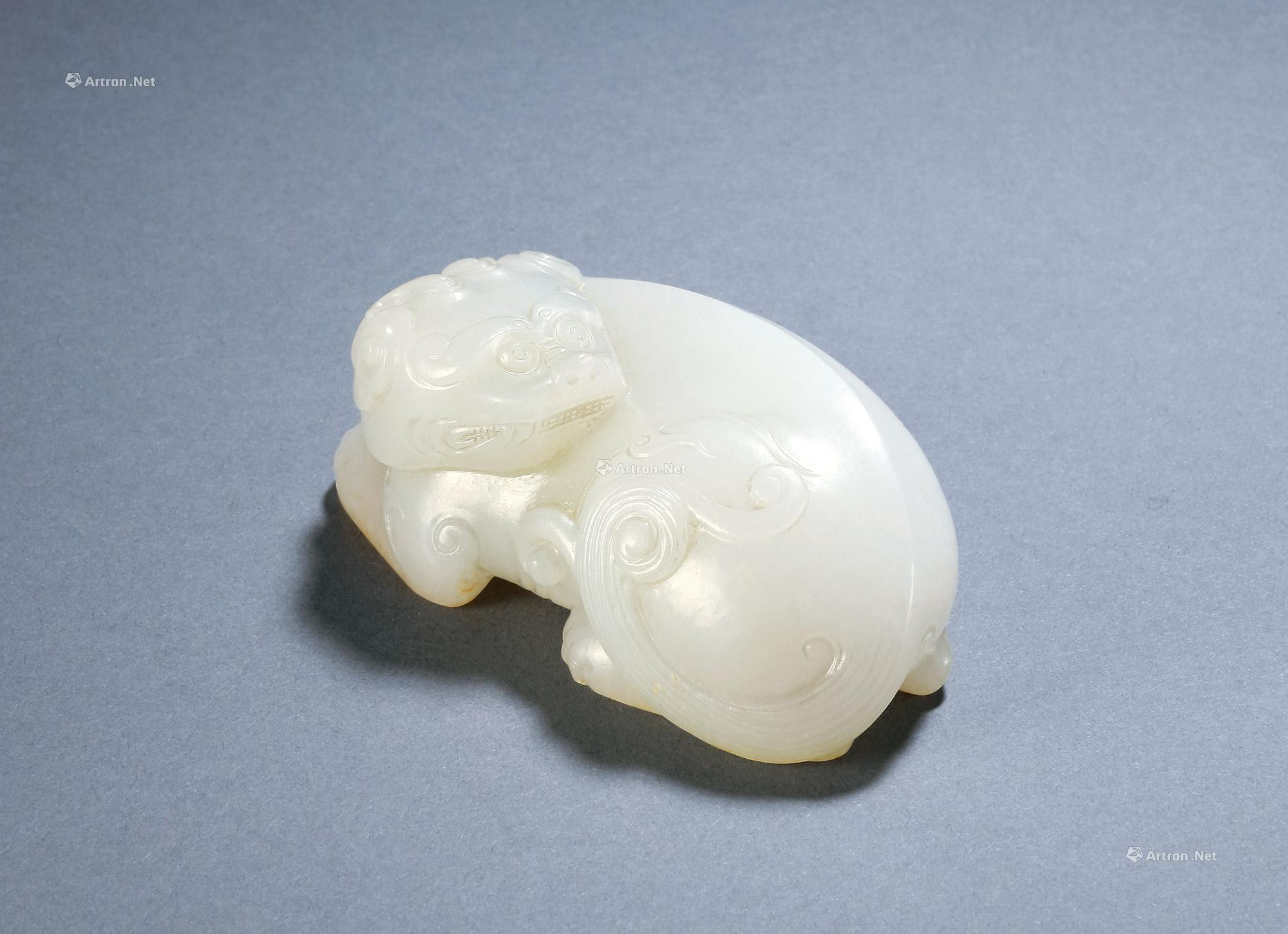 WHITE JADE CARVED PAPERWEIGHT WITH DESIGN OF MYTHICAL BEAST