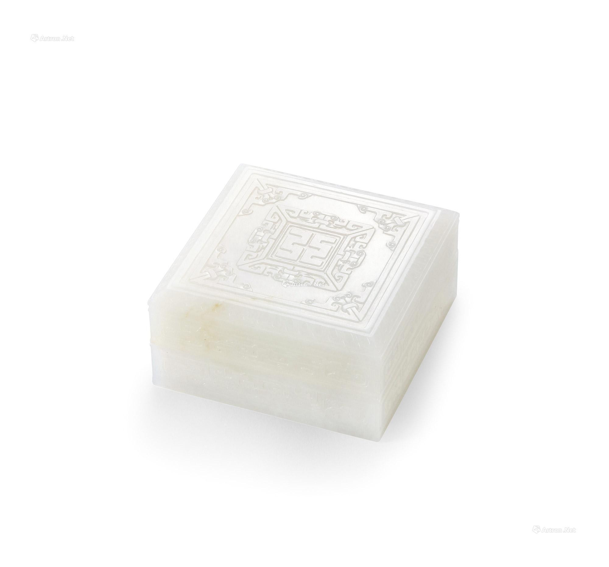 A FINELY CARVED WHITE JADE SQUARE-FROMED BOX AND COVER