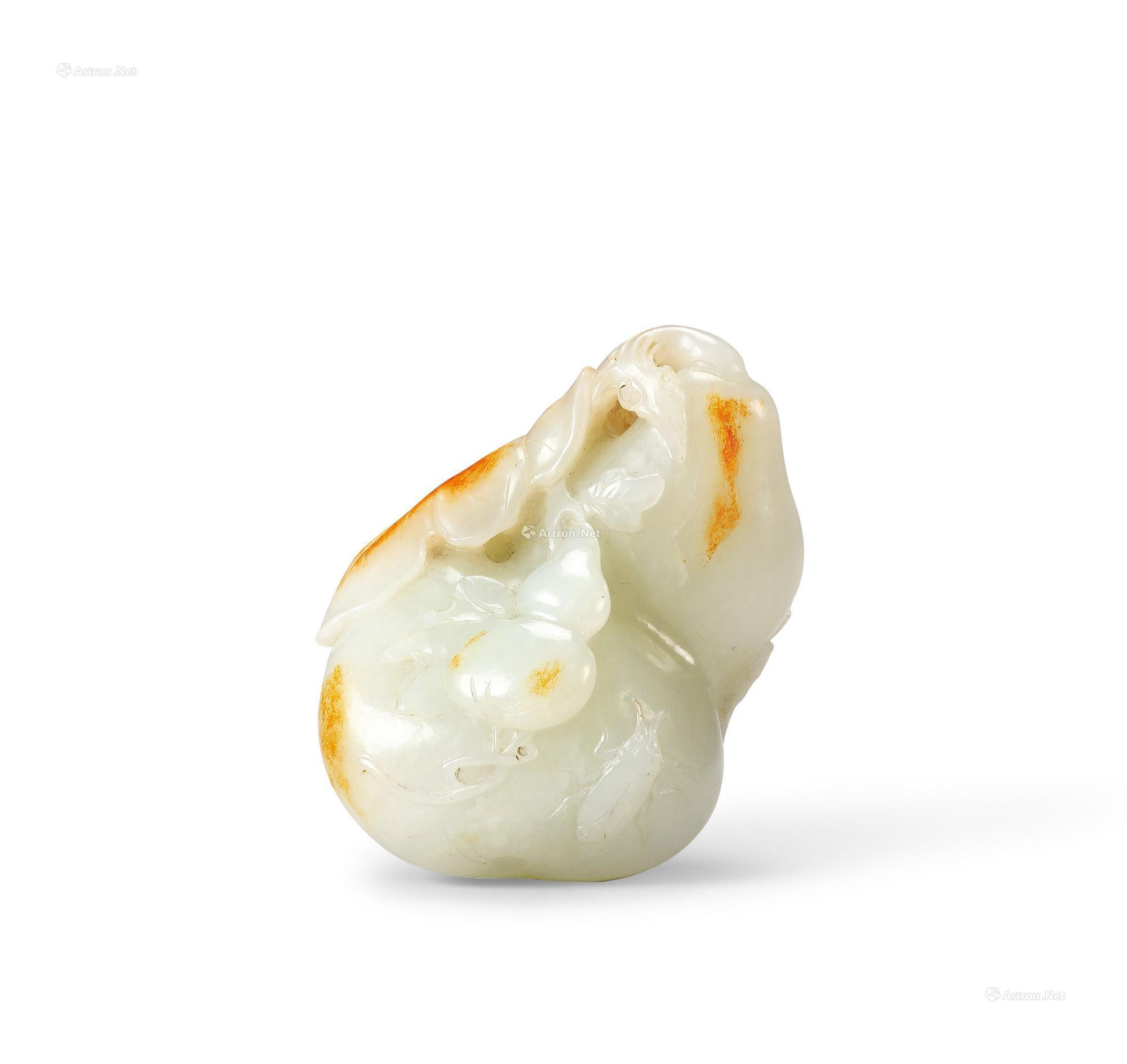 A FINELY CARVED WHITE JADE DOUBLE-GROUND SHAPED PAPER-WEIGHT