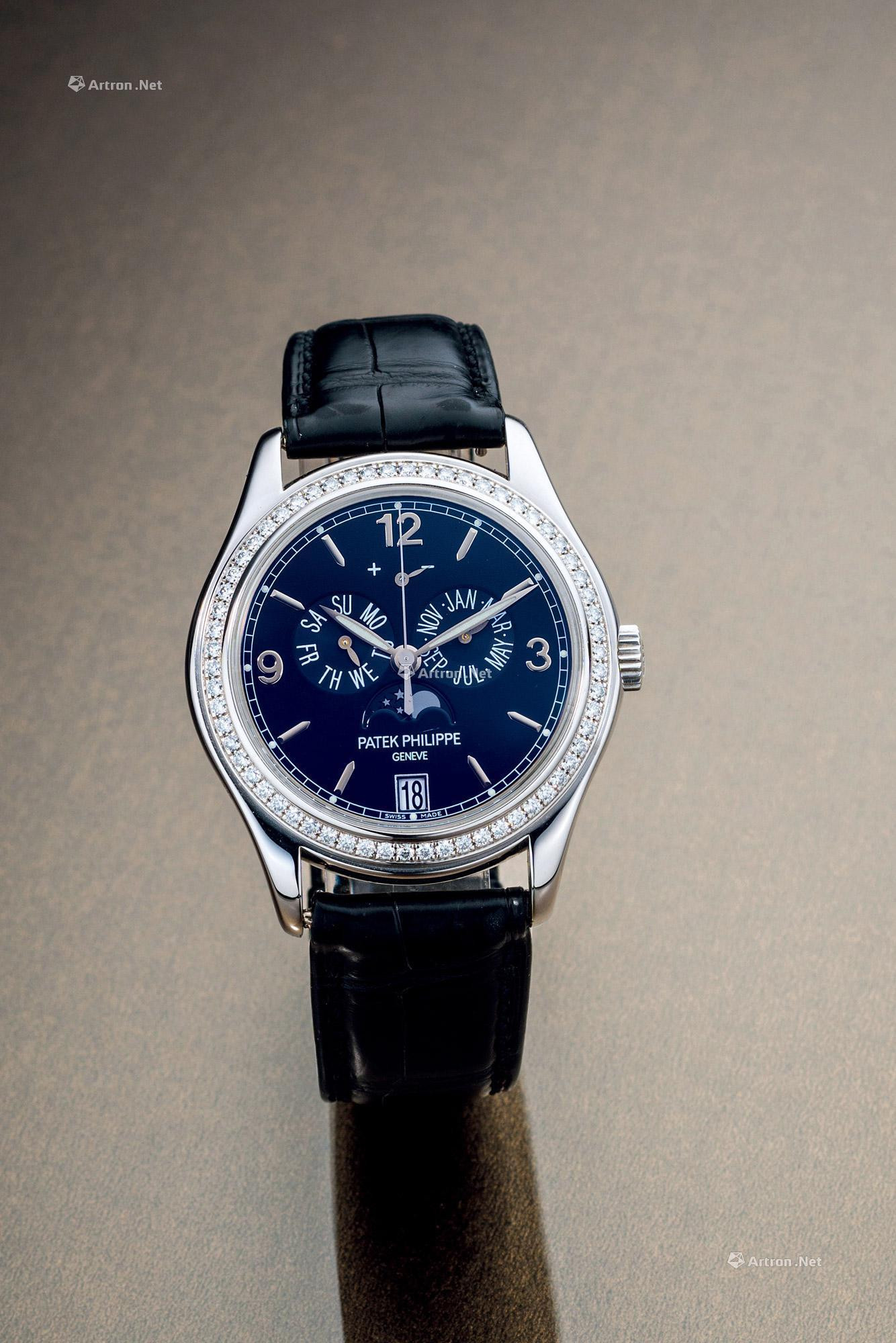 PATEK PHILIPPE  A FINE WHITE GOLD AND DIAMOND-SET ANNUAL CALENDAR AUTOMATIC WRISTWATCH， WITH DATE， DAY， MONTH， MOON PHASES AND POWER RESERVE INDICATORS， EXTRACT FROM THE ARCHIVES