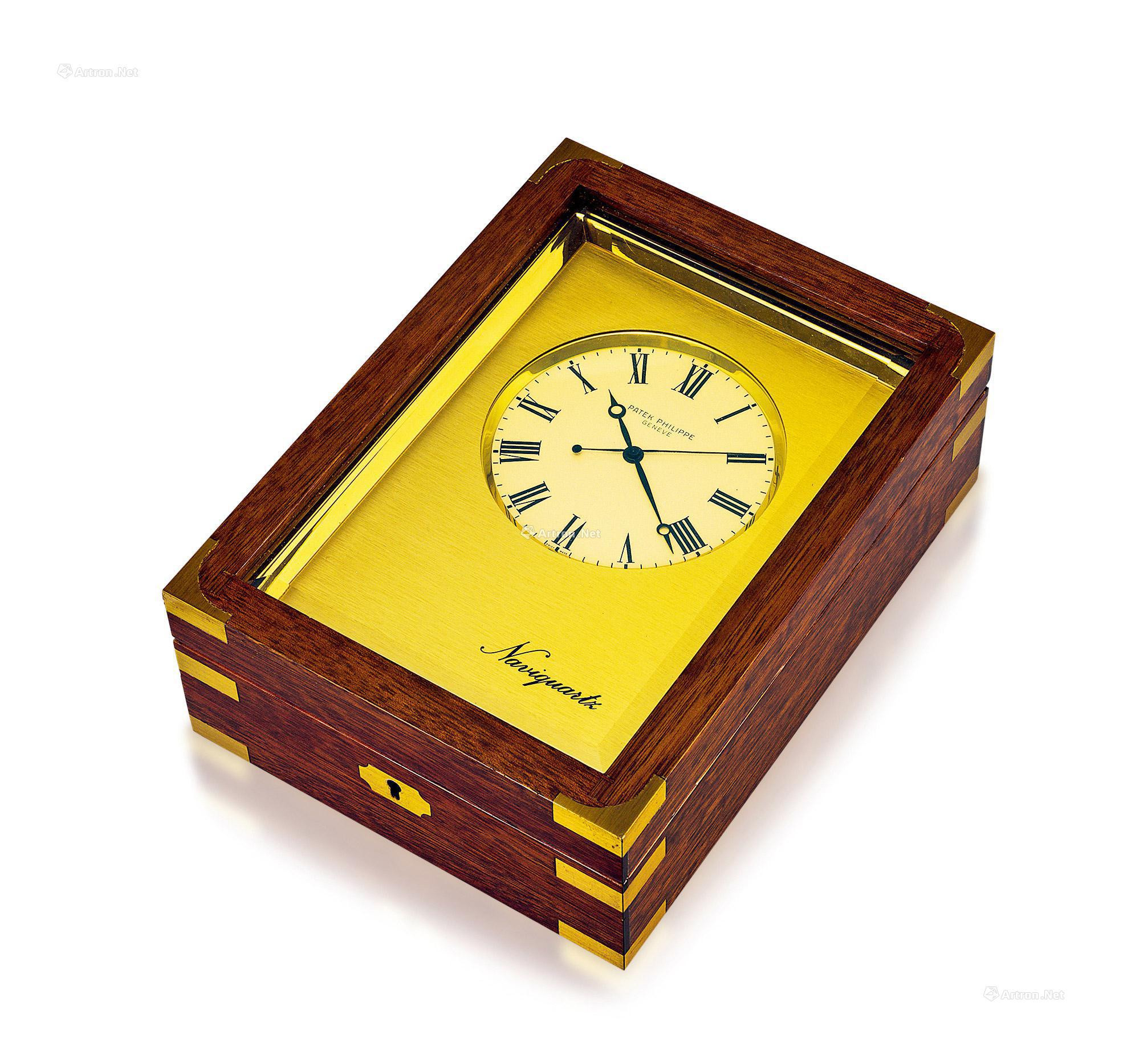 PATEK PHILIPPE  A FINE GILT BRASS AND WOODEN TABLE CLOCK， WITH KAY AND CERTIFICATE OF ORIGIN