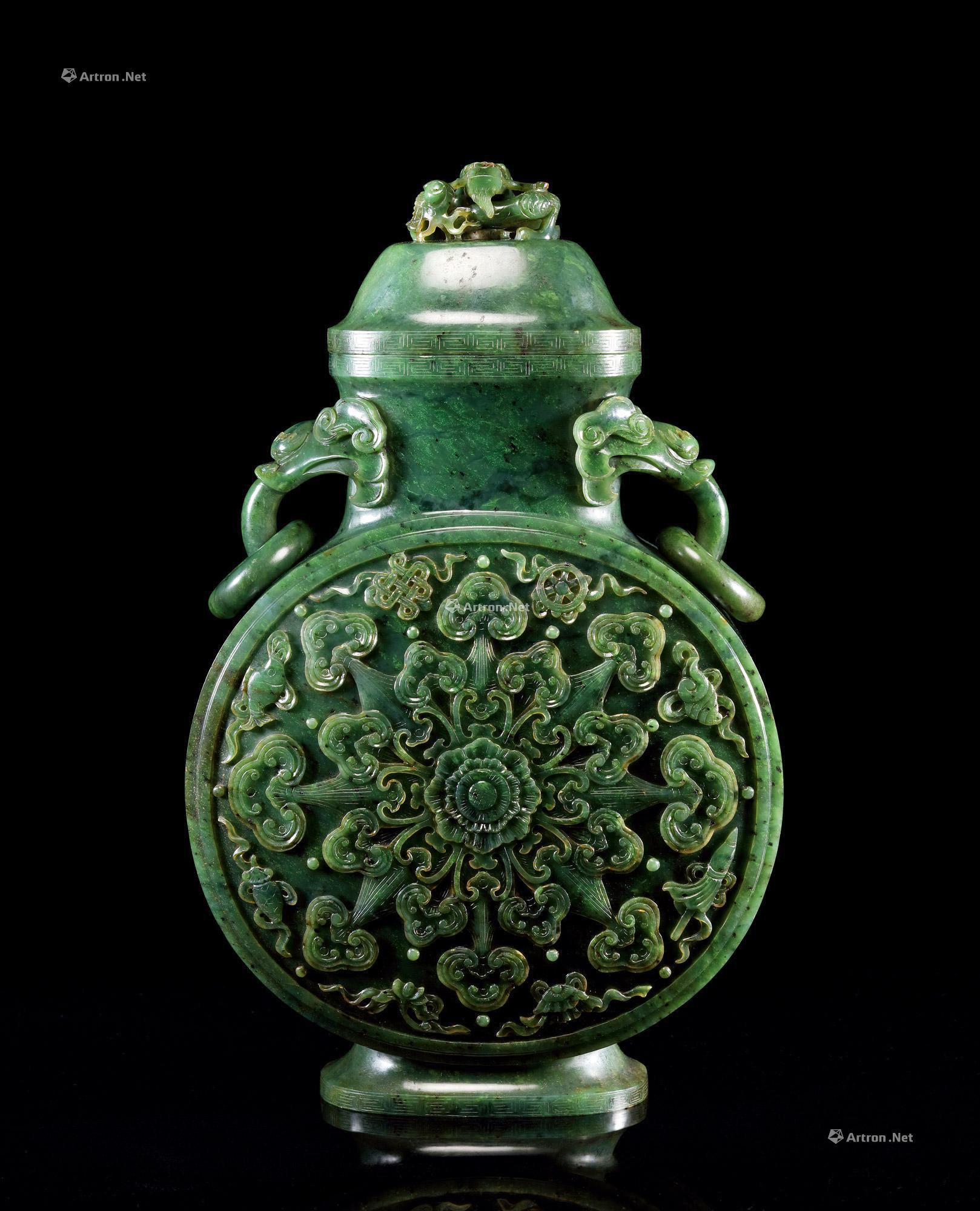 AN IMPERIAL GREEN JADE CARVED EIGHT EMBLEMS AND LOTUS PATTERNED MOON VASE WITH DRAGON-KNOB