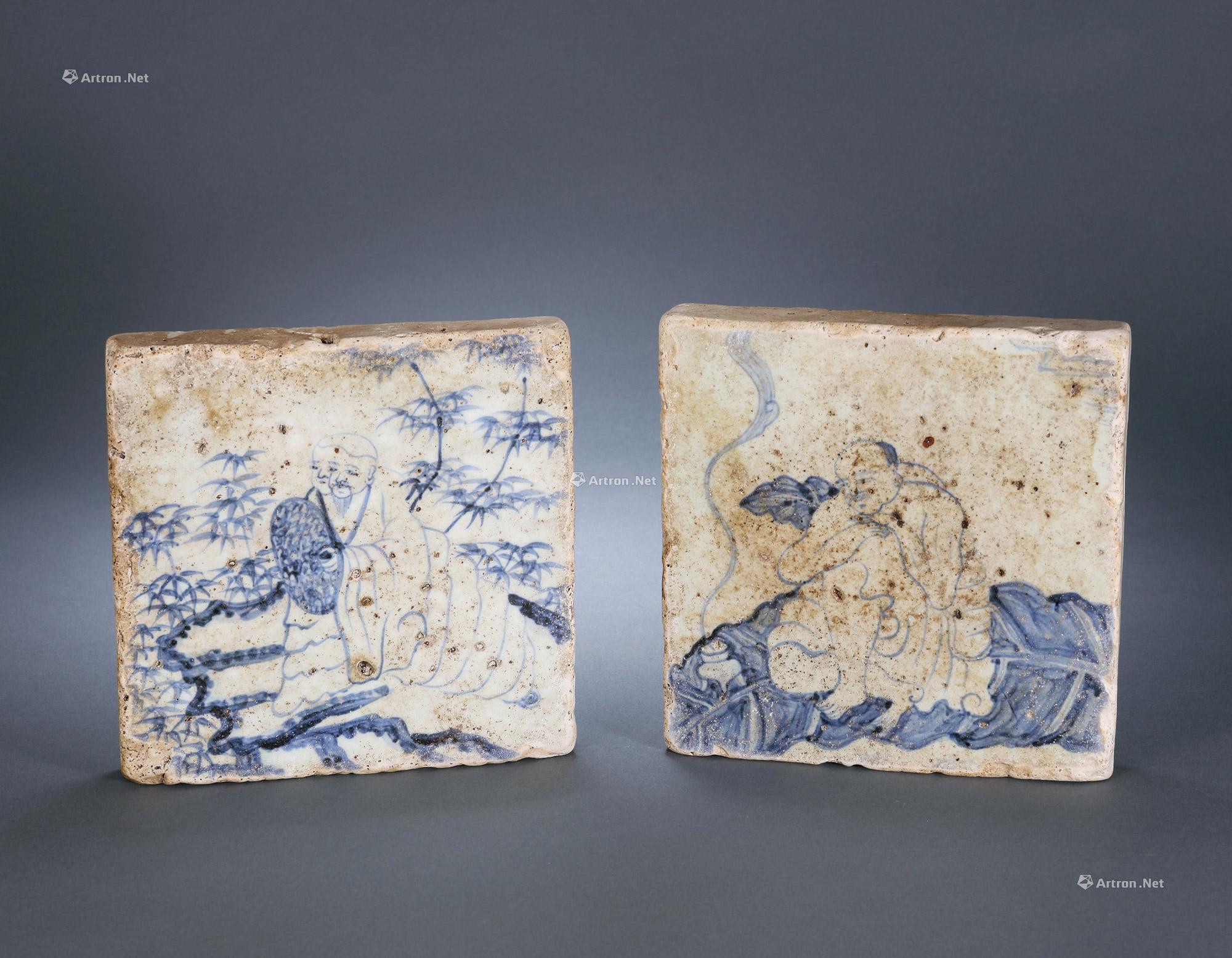 A SET OF TWO BLUE AND WHITE CERAMIC TILES WITH ARHATS DESIGN
