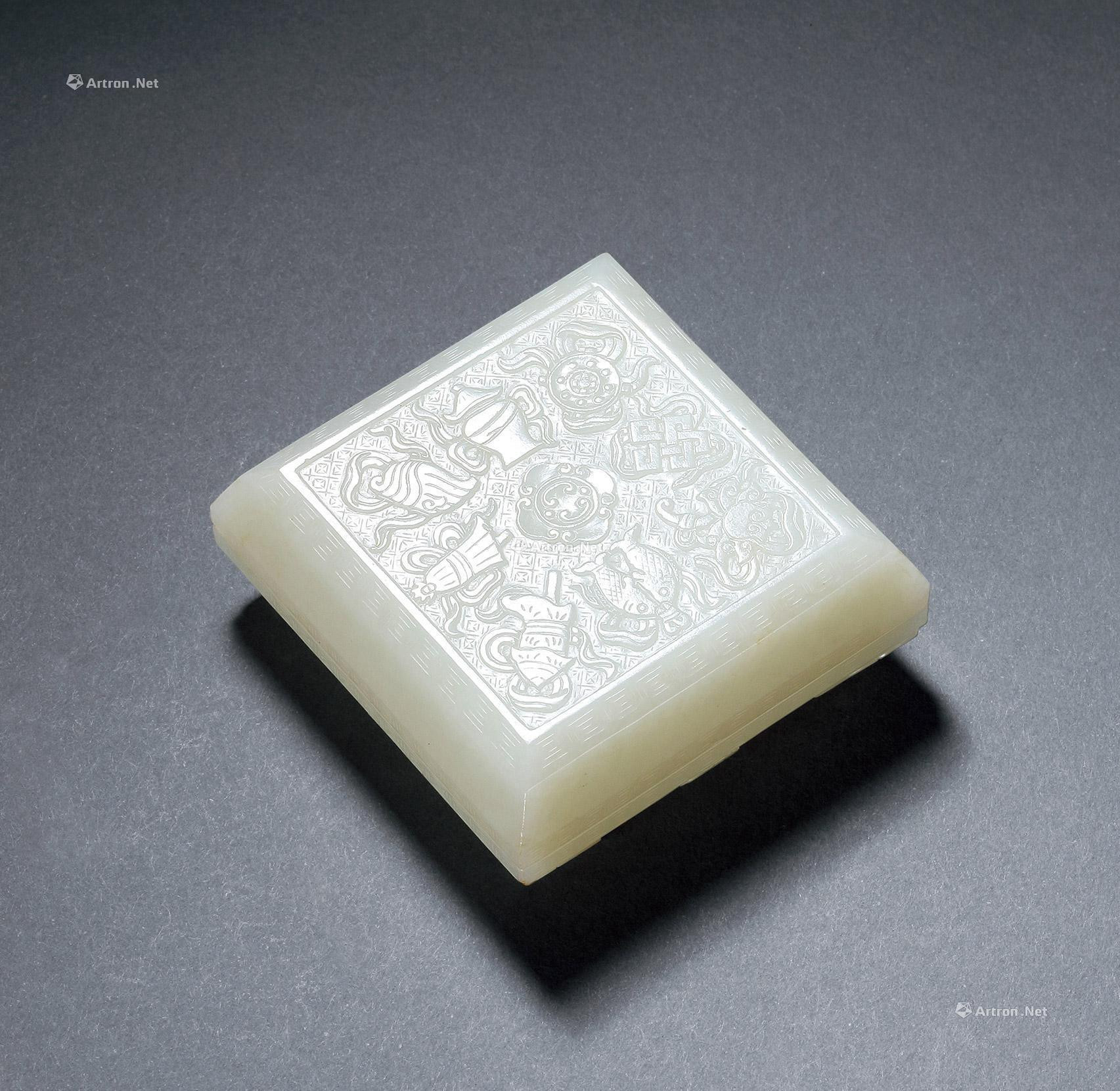 A CARVED WHITE JADE BOX WITH DESIGN OF EIGHT GOOD SYMBOLS