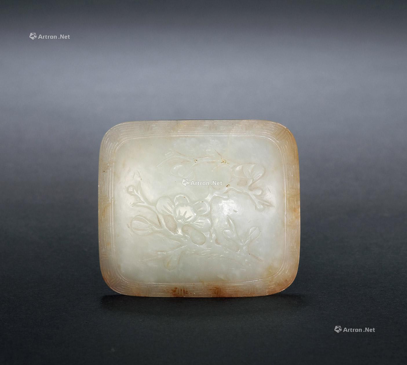 A CARVED GREENISH WHITE JADE BELT HOOK WITH DESIGN OF PLUM BLOSSOMS