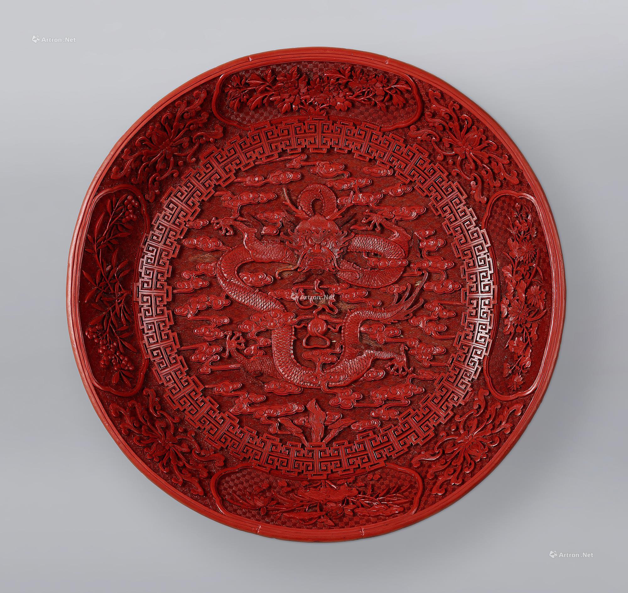 A CINNABAR LACQUER ‘FOUR-SEASON FLOWERS’ PLATTER WITH DESIGN OF CLOUD AND DRAGON