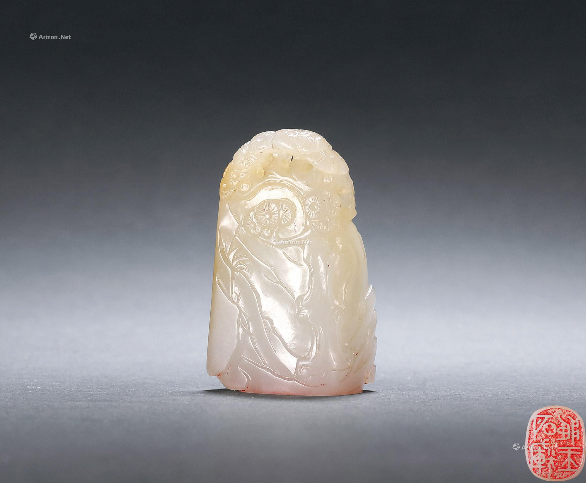 A WHITE JADE ‘LANDSCAPE’ SEAL WITH KNOB