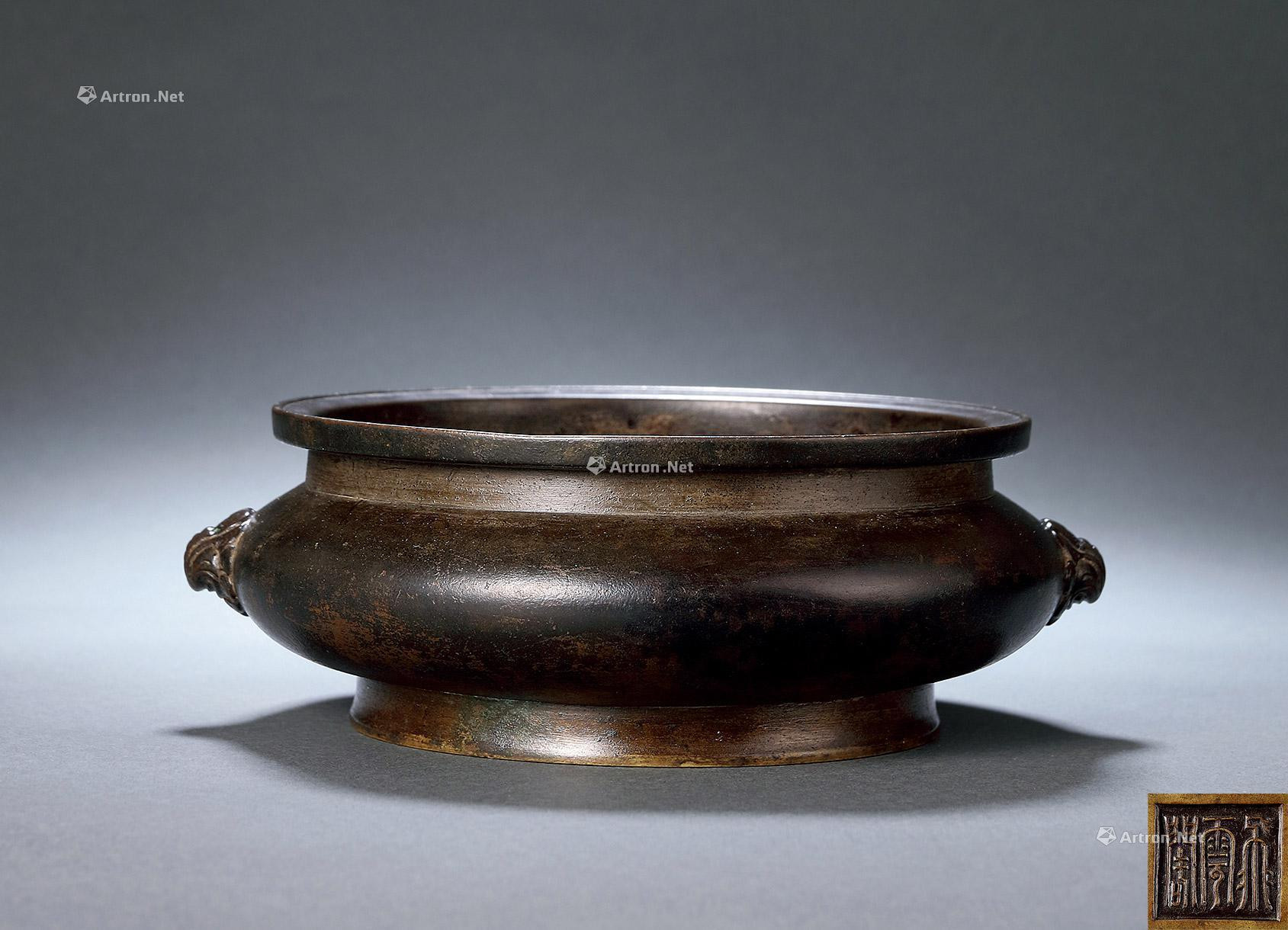 A BRONZE GUI-STYLE INCENSE BURNER WITH DOUBLE LION-HEAD EARRS