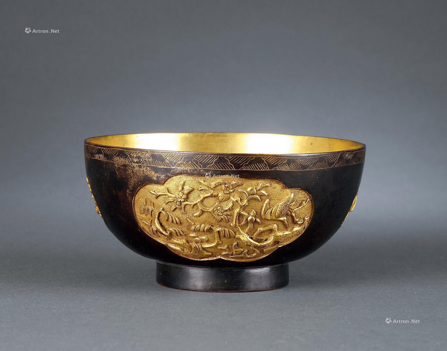 A GOLD-COPPER BOWL WITH DESIGN OF FLOWER AND BIRD