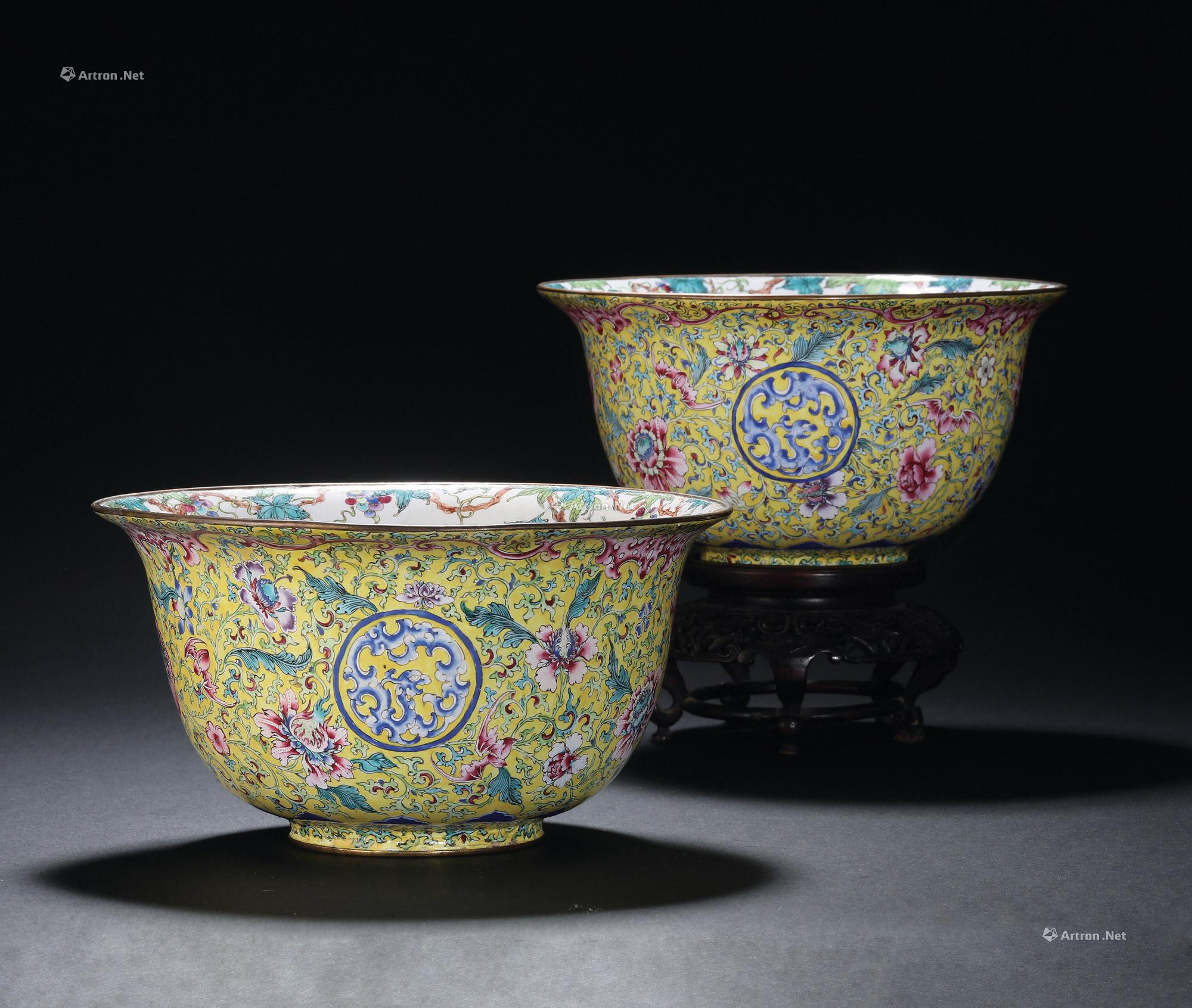 A PAIR OF YELLOW GROUND PAINTED ENAMEL FLOWER BOWL