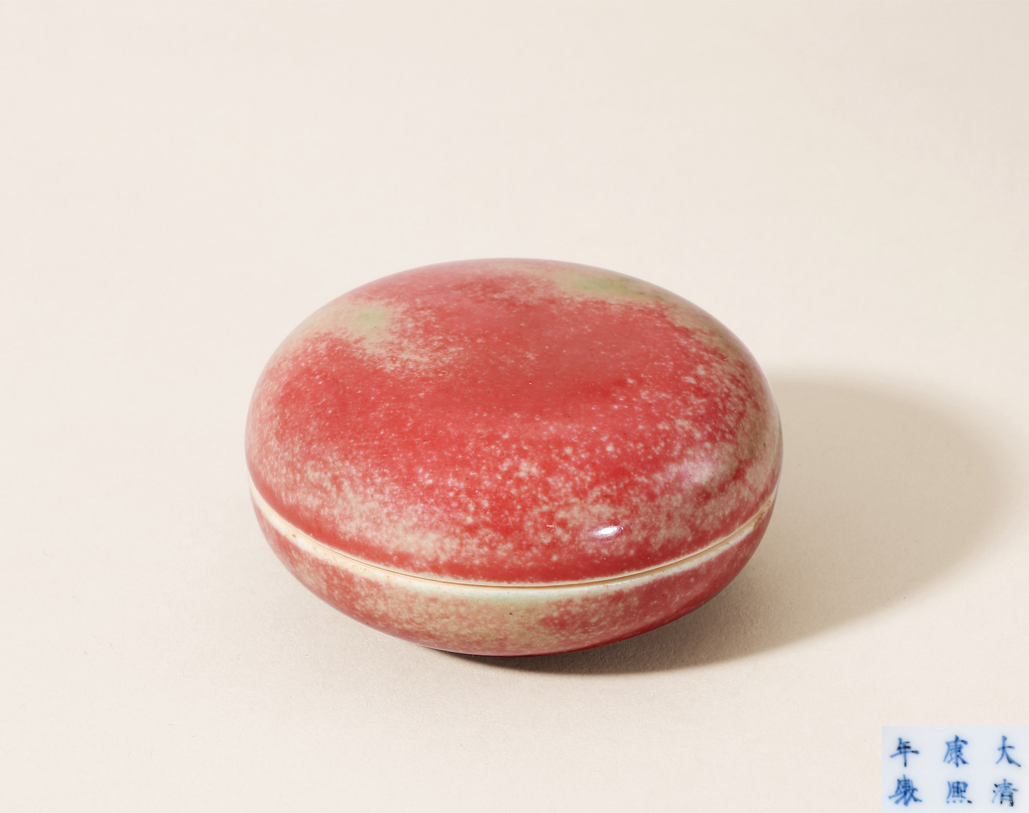 A PEACHBLOOM GLAZED SEAL-PASTE BOX AND COVER