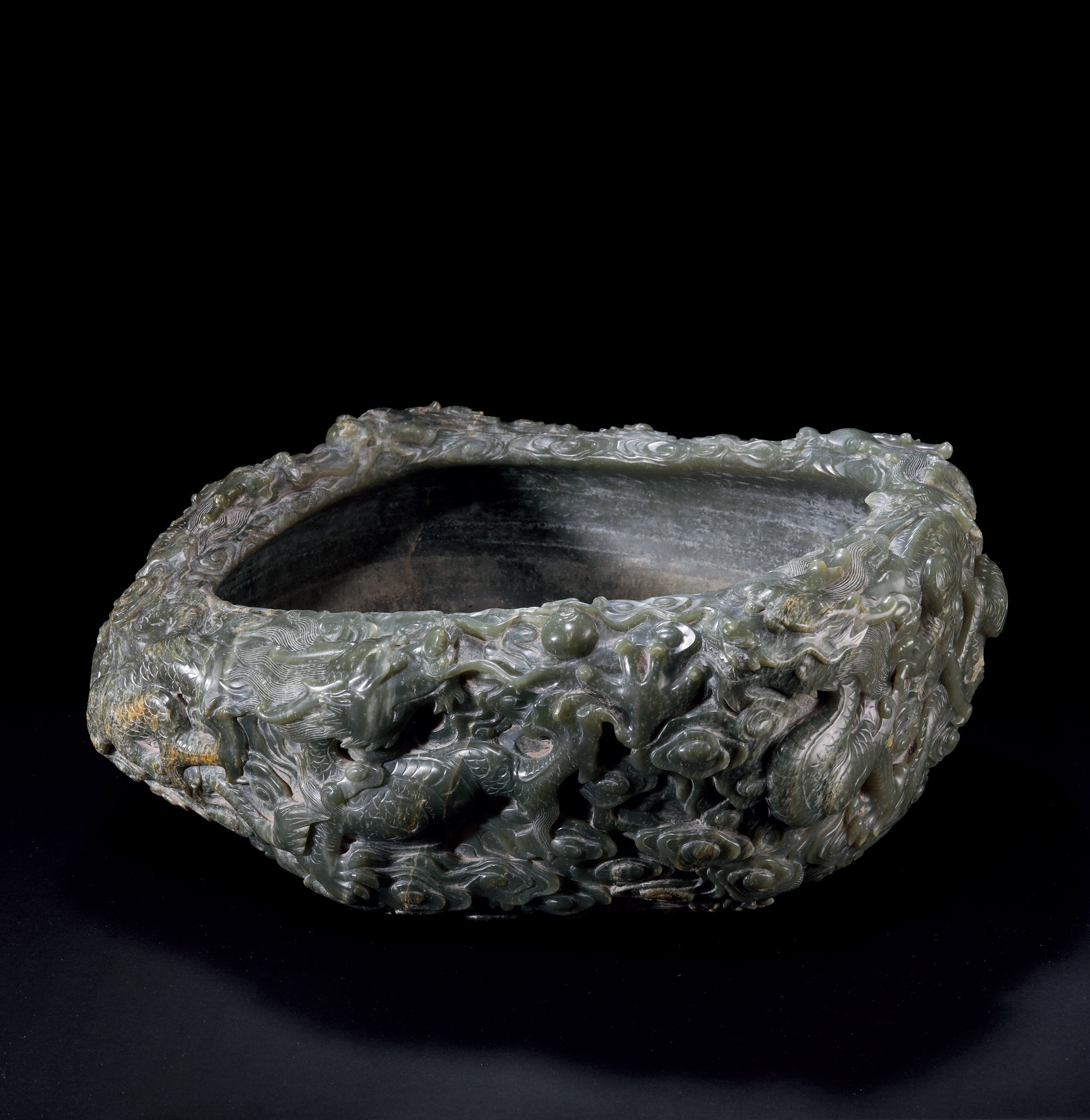 A CARVED JADE ‘DRAGON’ WASHER