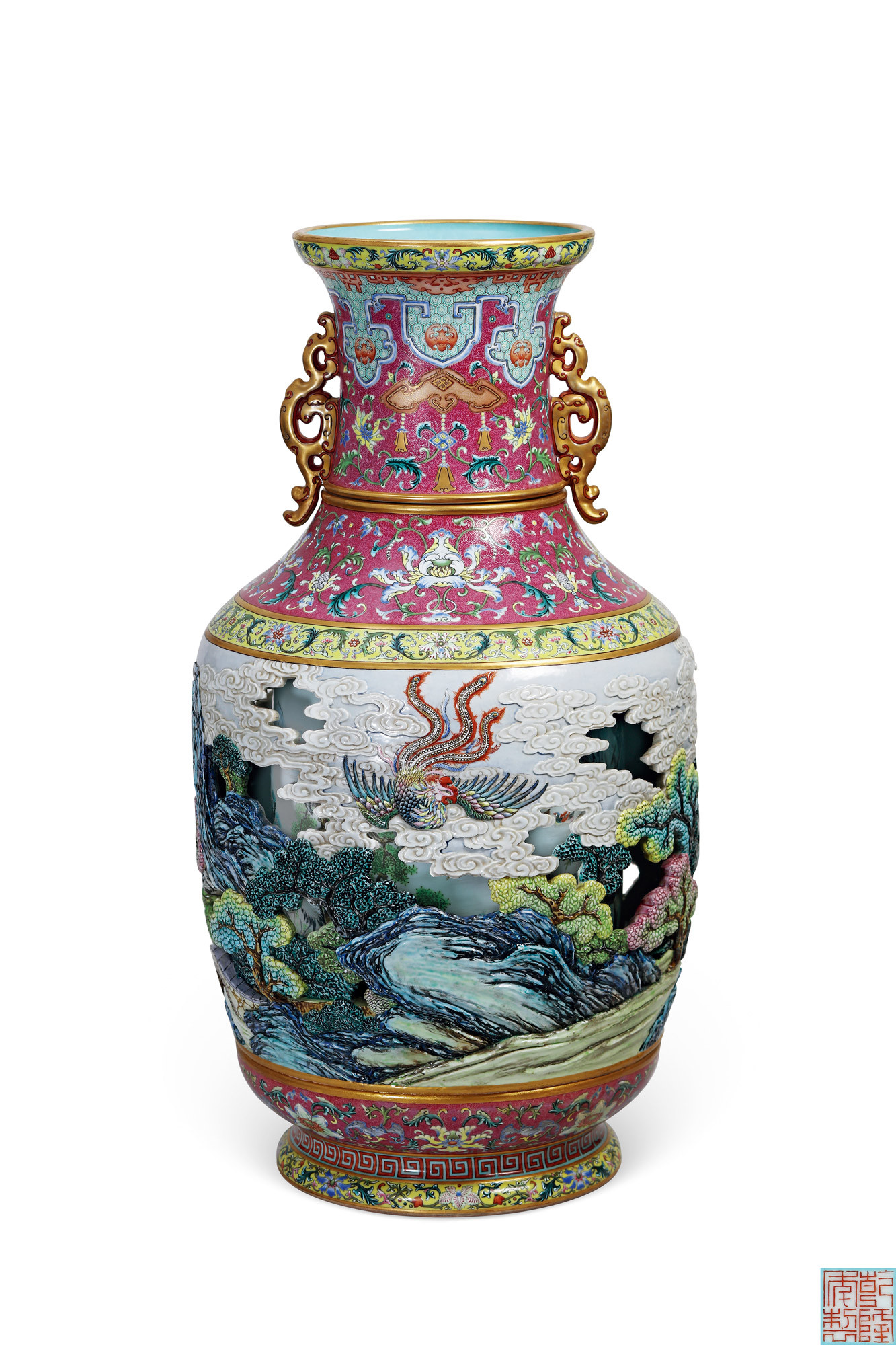 A MAGNIFICENT AND EXTREMELY RARE YANGCAI RUBY-GROUND WITH CARVED OPEN-WORK ‘PHOENIX SCENE’ REVOLVING VASE