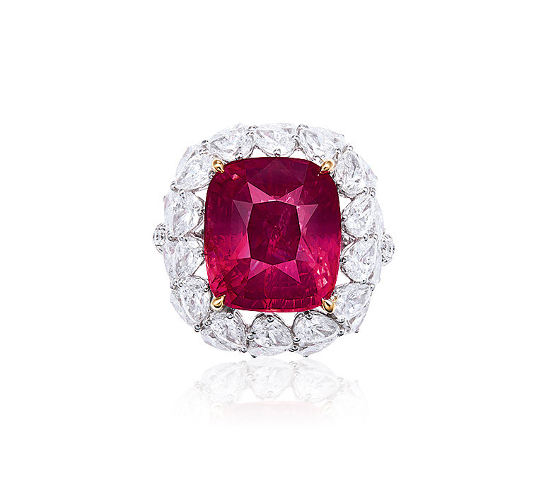 A 10.20 CARAT tanzanian ORANGY-PINK SPINEL AND DIAMOND RING