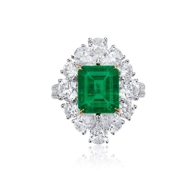 A 2.60 CARAT COLOMBIAN EMERALD AND DIAMOND RING<br>Centering a 2.60 carats octagonal shaped emerald, framed with circular and pear shaped diamonds weighing 3.89 carats in total, mounted in 18K gold, ring size 14