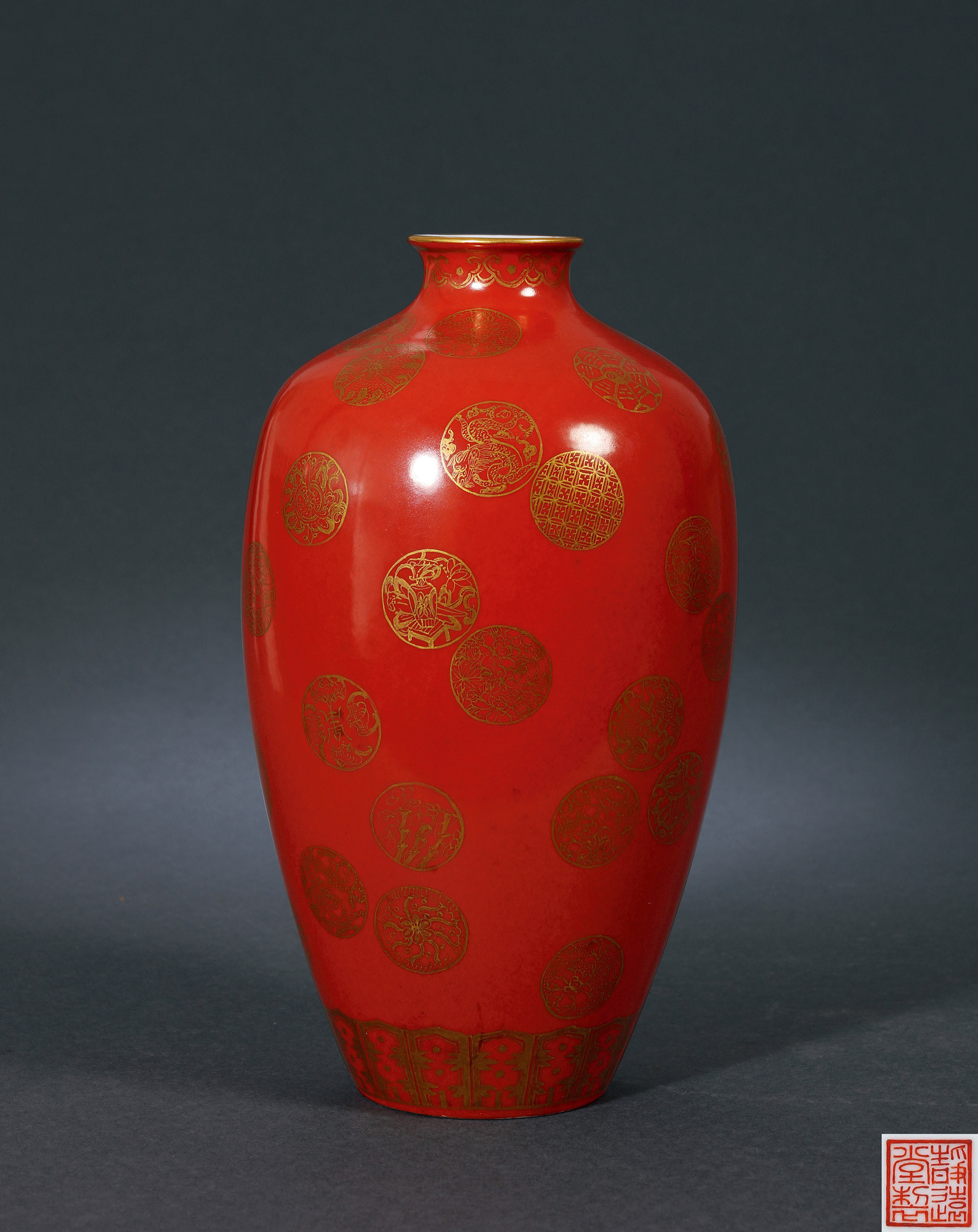 A CORAL RED AND GILTED VASE