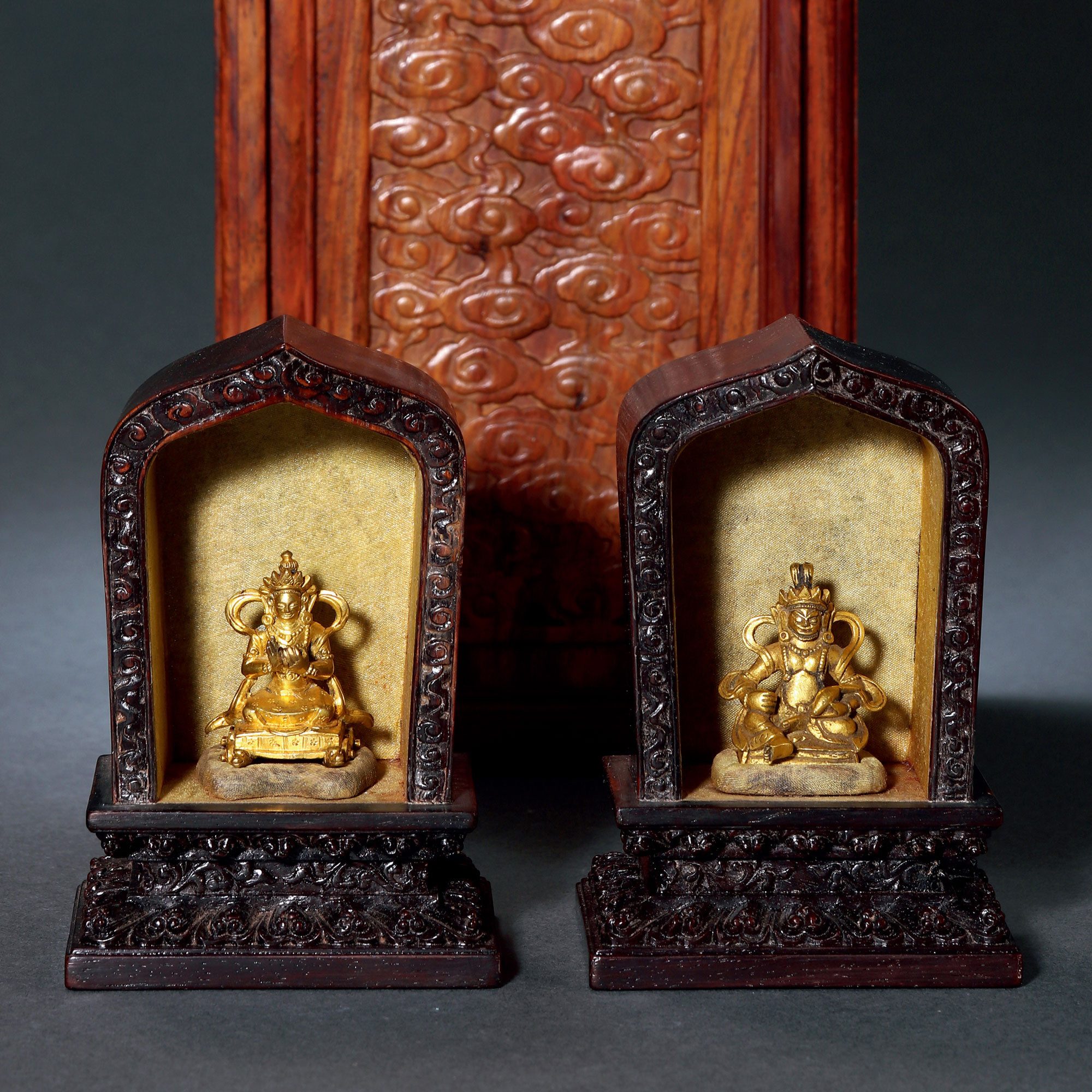 A SET OF TWO GILT-BRONZE GOD OF WEALTH AND GUARDIAN BUDDHA