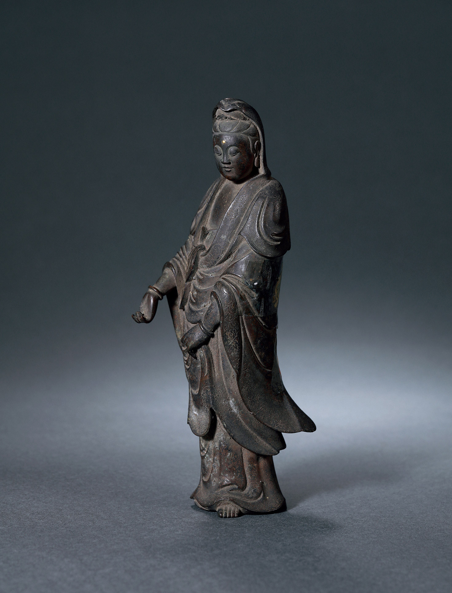 A BRONZE GOLD-INLAID STANDING BAIHAO GUANYIN 