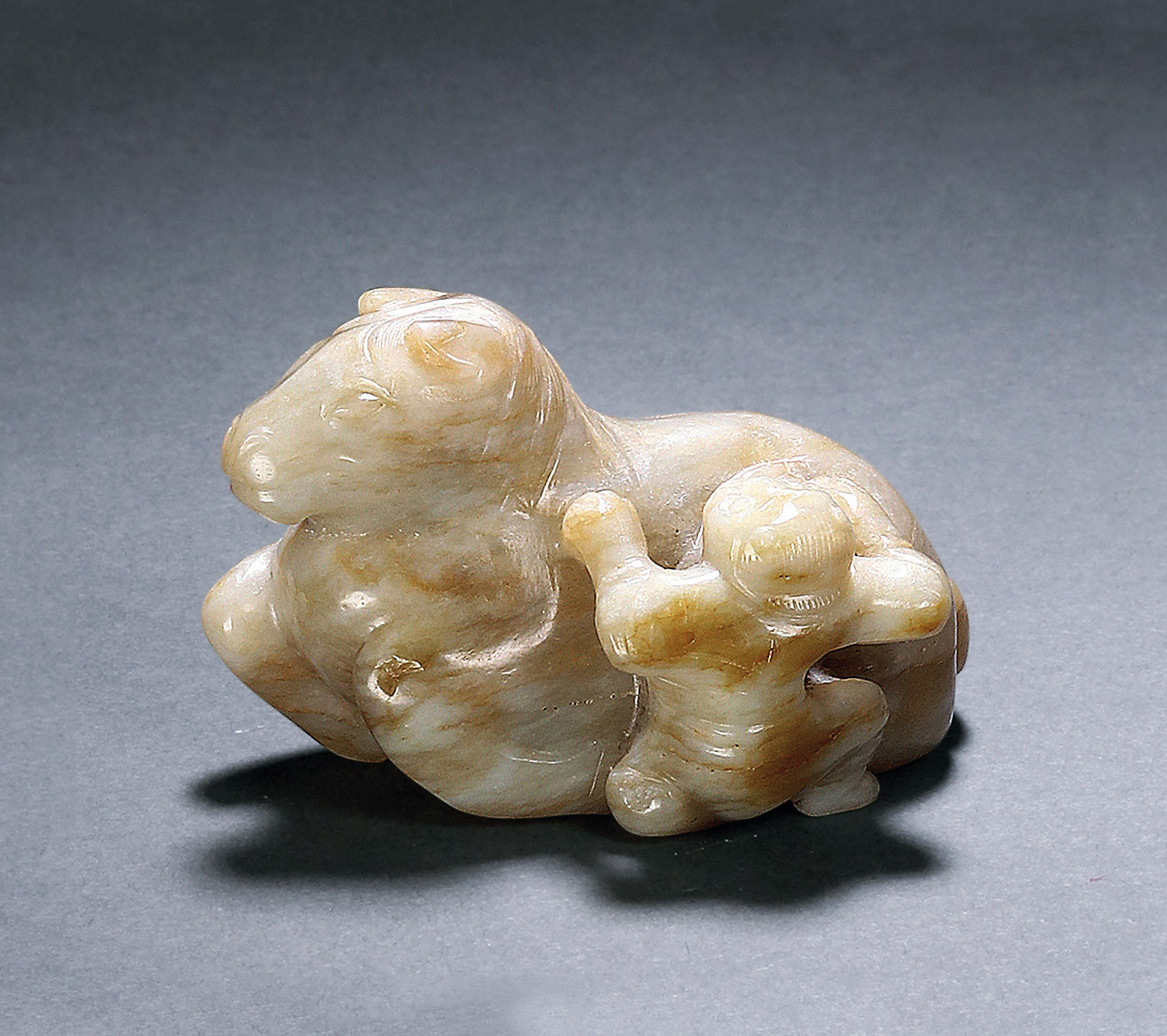 A WHITE JADE‘FOREIGNER AND HORSE’PAPER WEIGHT