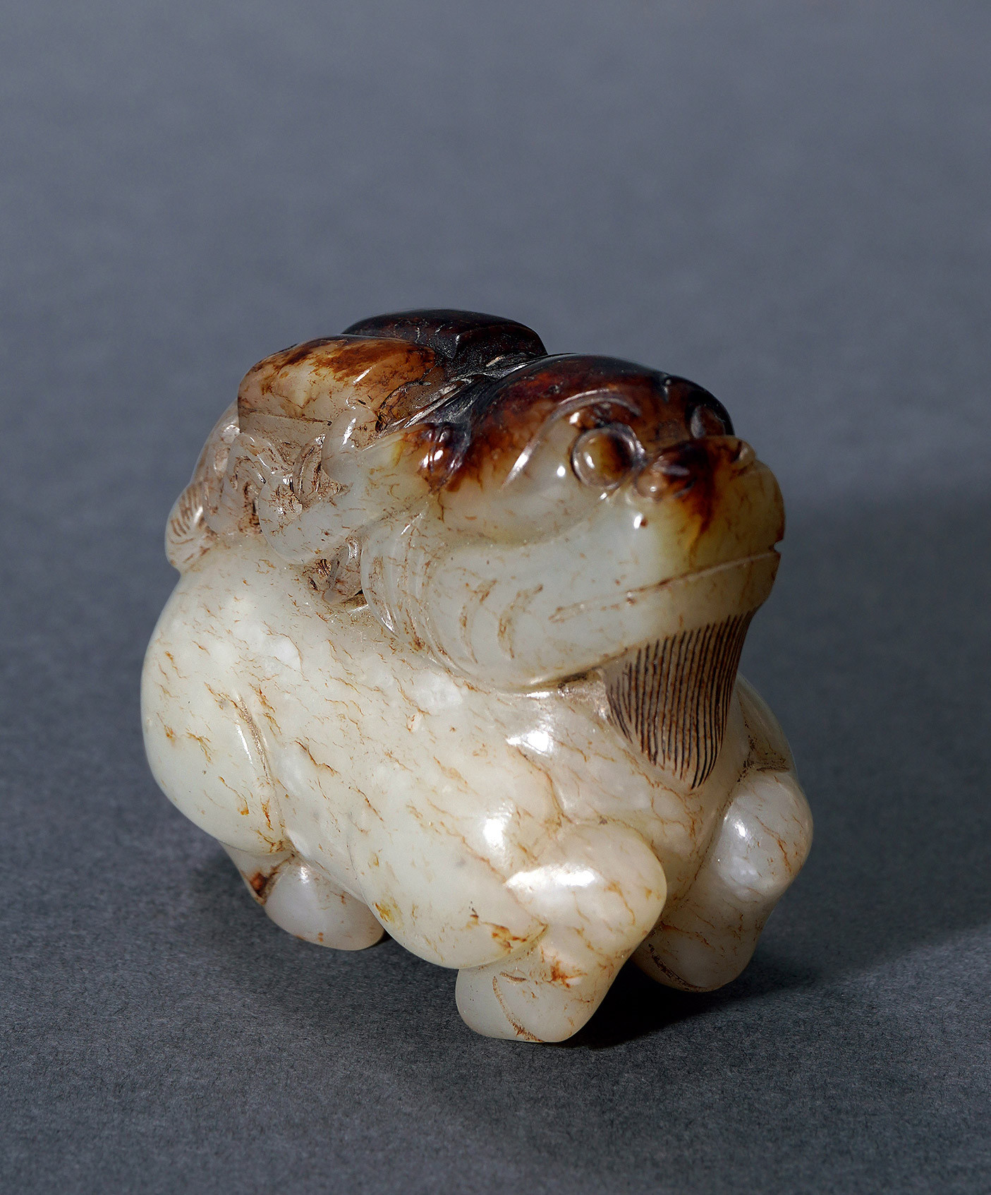 A WHITE JADE WITH CARVING OF‘QILIN BEARS BOOKS’