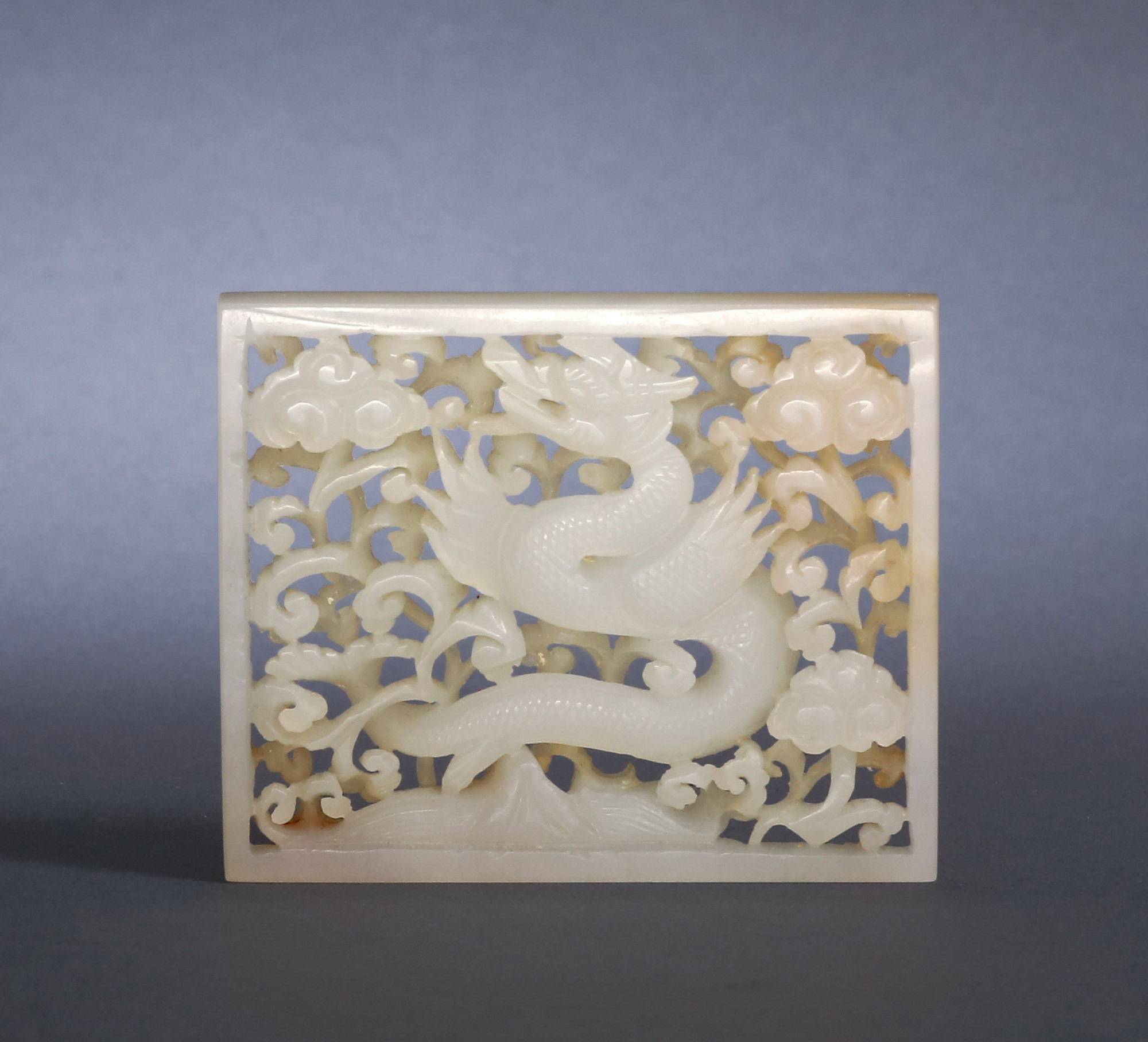 A SQUARE WHITE JADE PLATE WITH DESIGN OF DRAGON