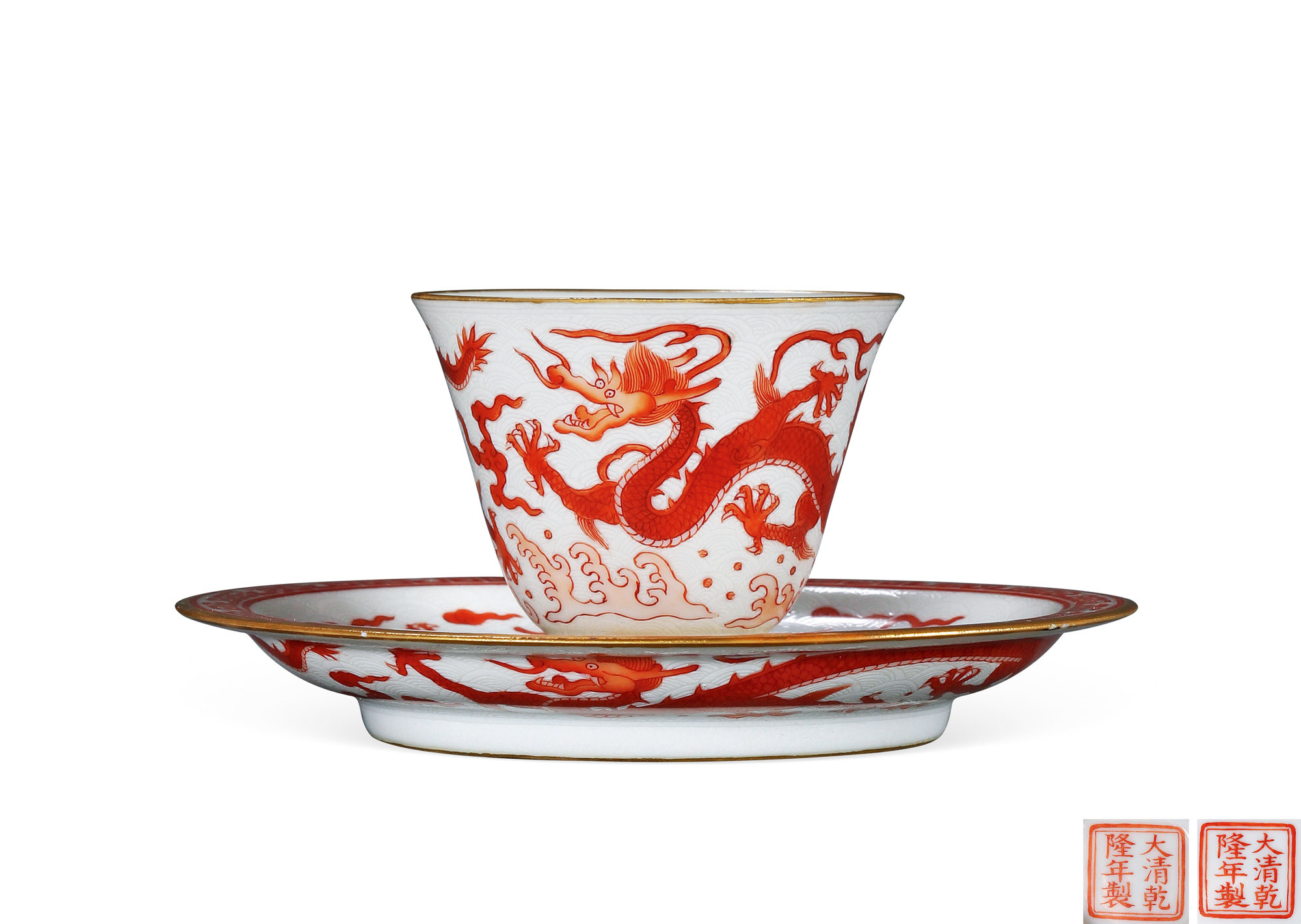 A SET OF TWO WHITE-GROUND AND IRON-RED‘DRAGON’ CUP AND SAUCER