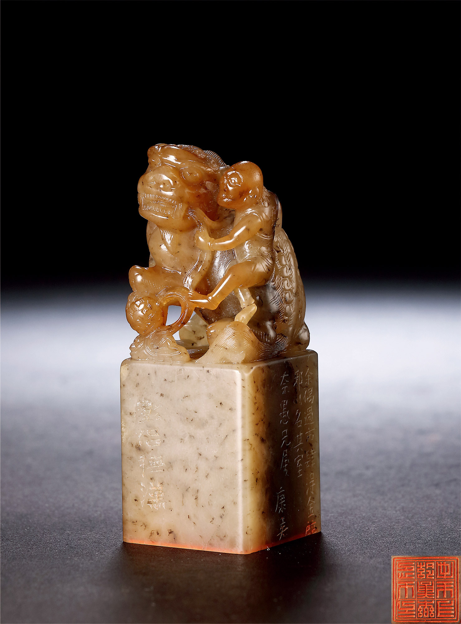 AN AGATE‘FOREIGNER AND LION’ SEAL, MADE BY ZHOU JUNSHANG AND INSCRIBED BY HUANG GAONIAN FOR TANG SHAOYUAN
