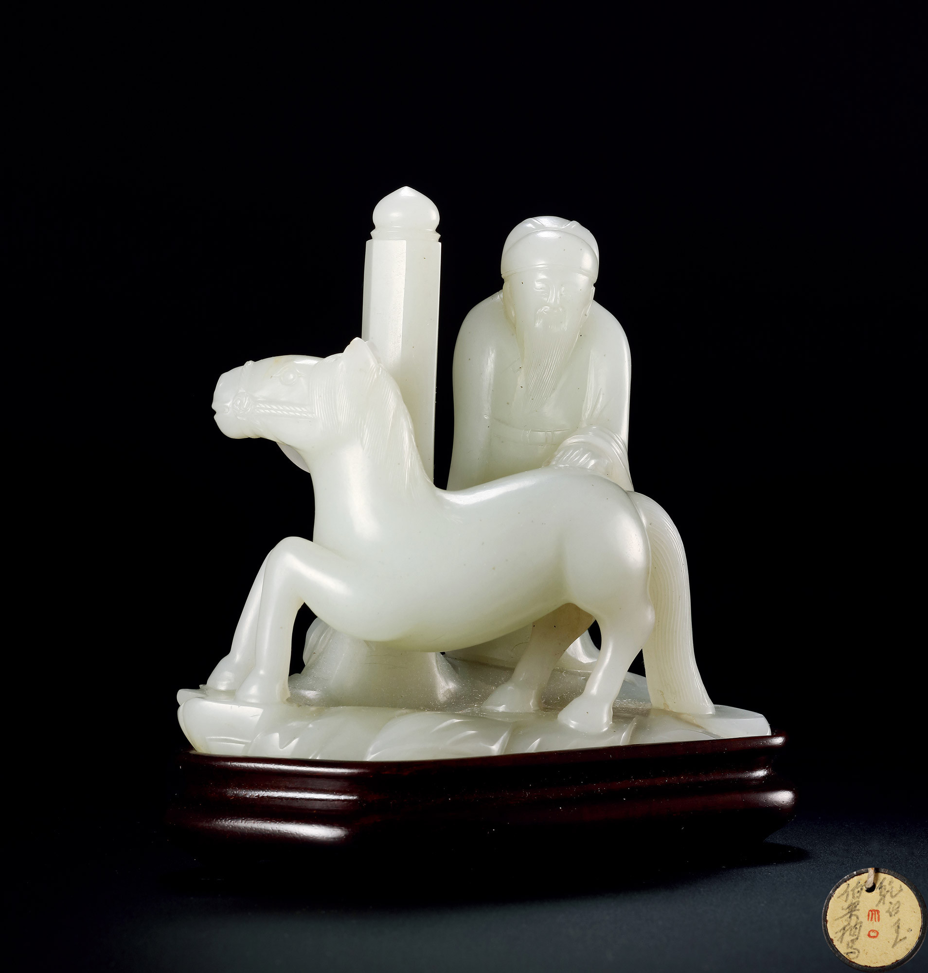 A CARVED WHITE JADE FIGURE AND HORSE ORNAMENT