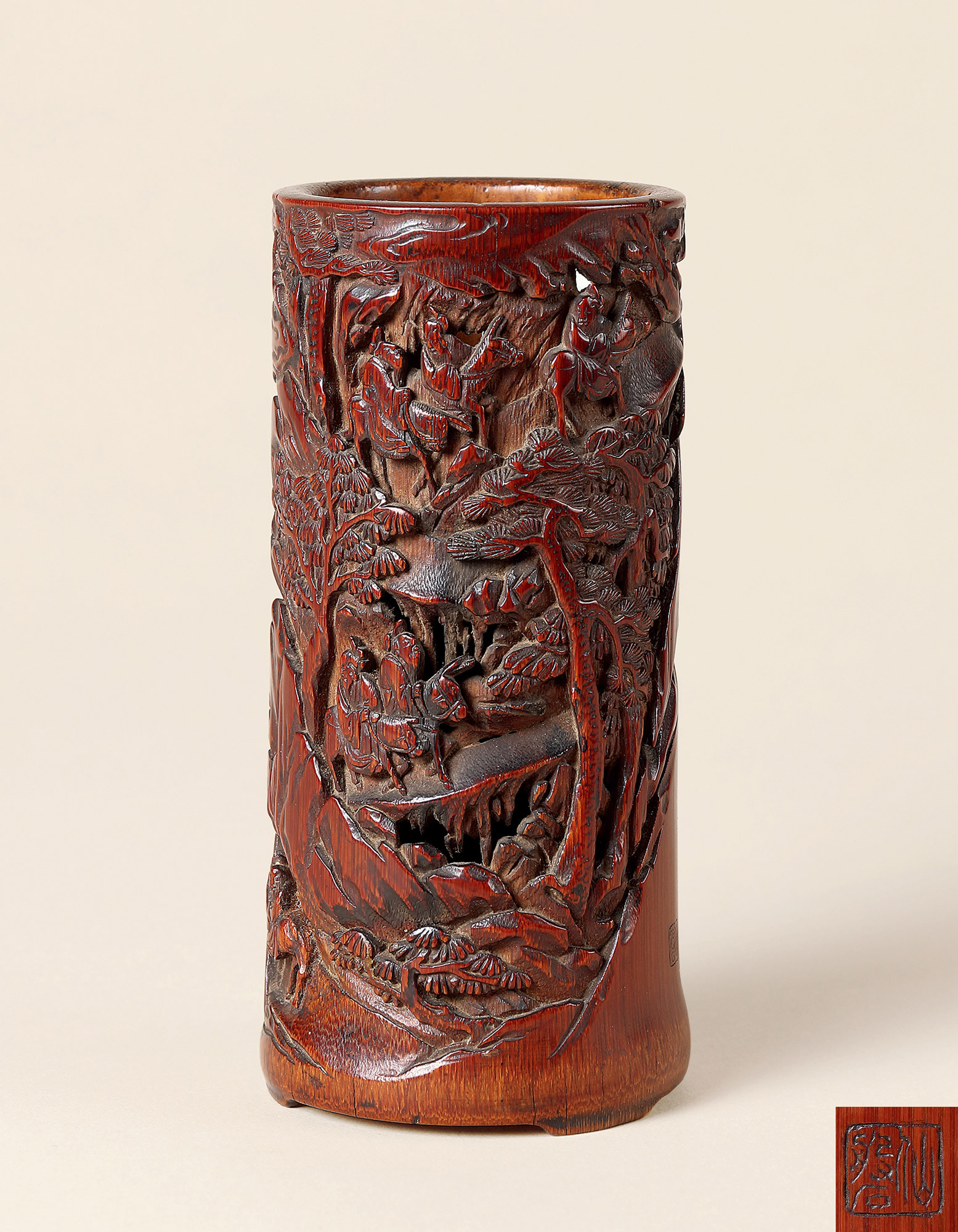 A BAMBOO CARVED ‘SCHOLAR TRAVELING’ BRUSH POT