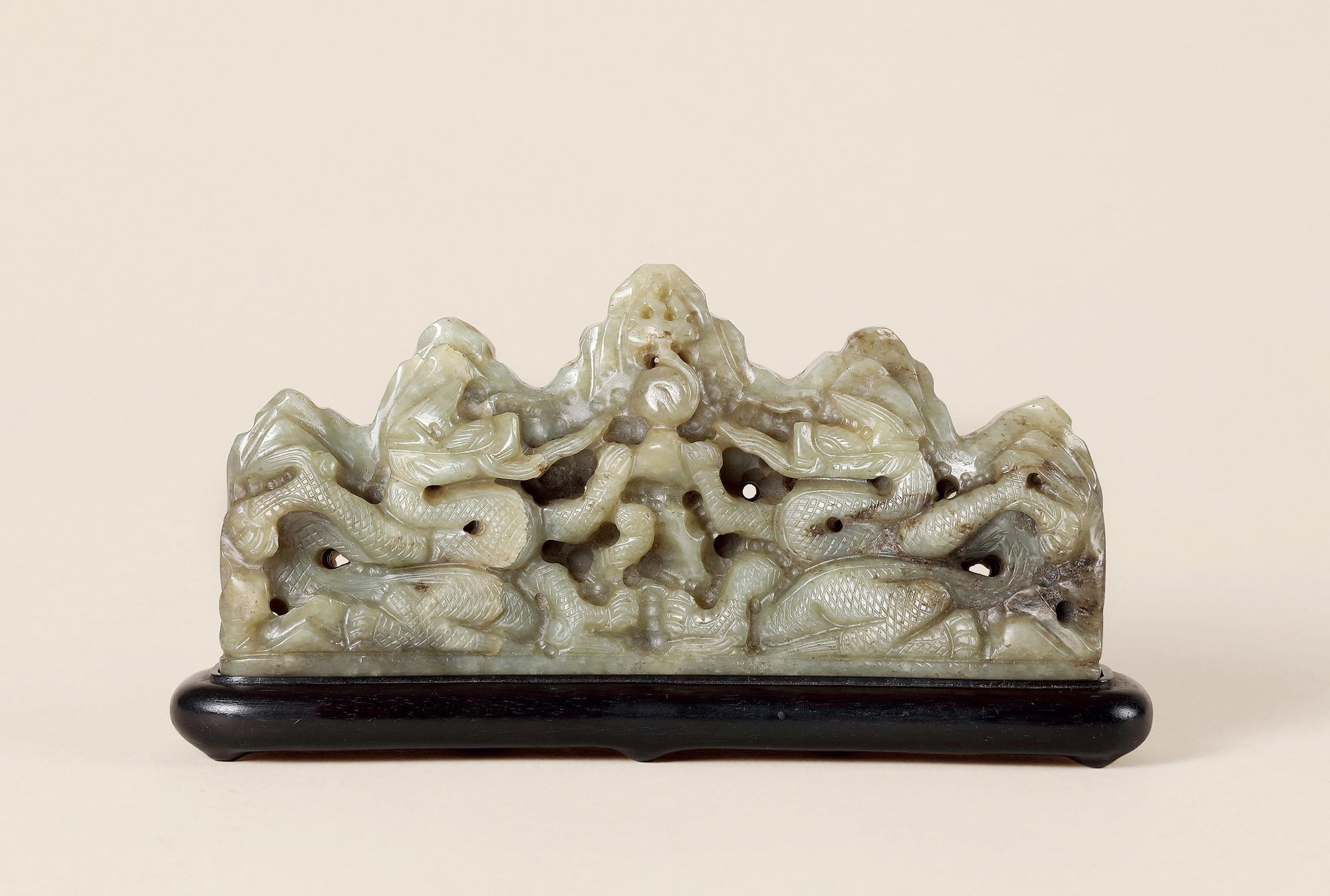 A GREENISH JADE CARVED DRAGONS CHASING PEARL BRUSH STAND