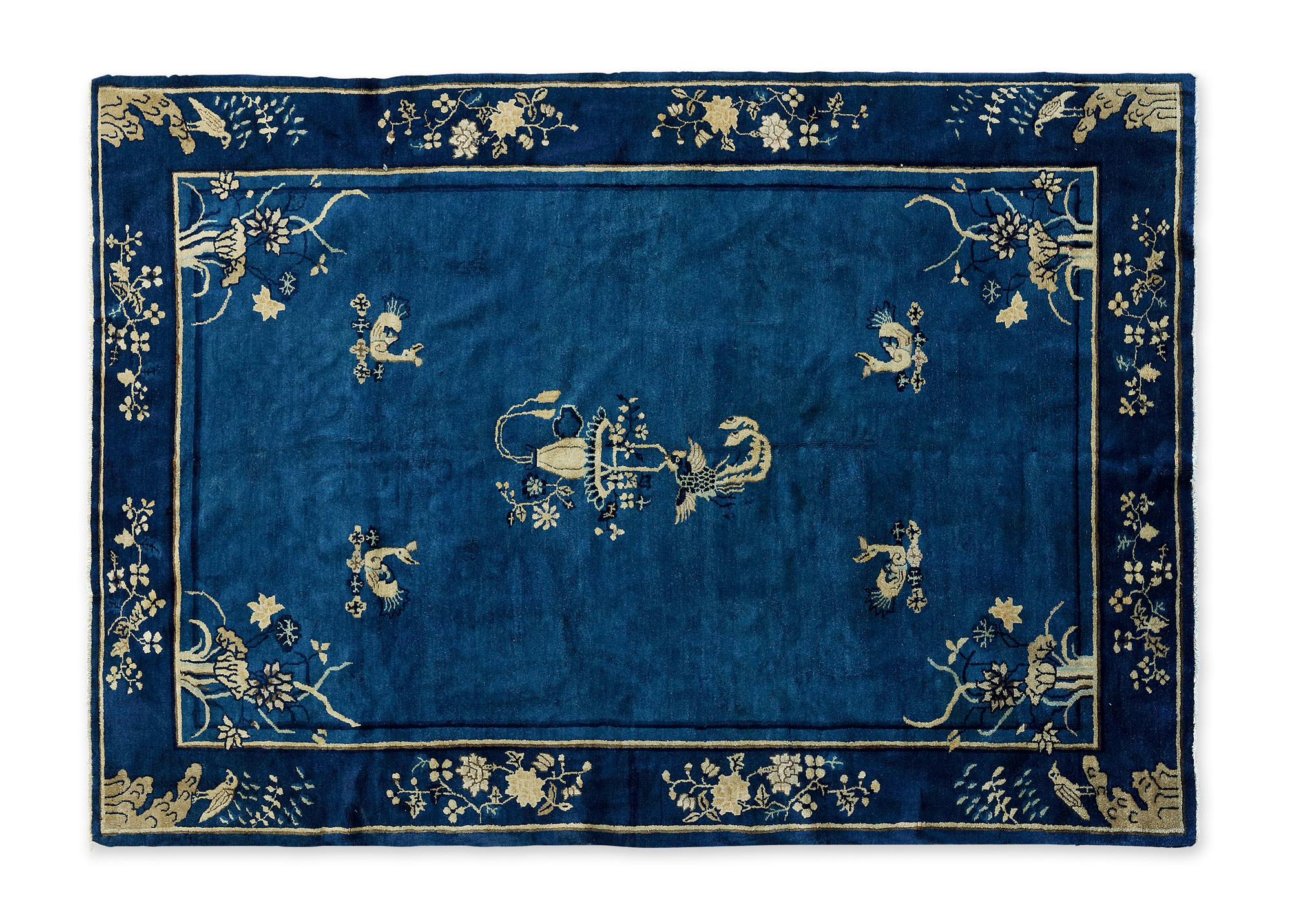 A BLUE GROUNDED ‘FLOWER AND BIRD’ CARPET