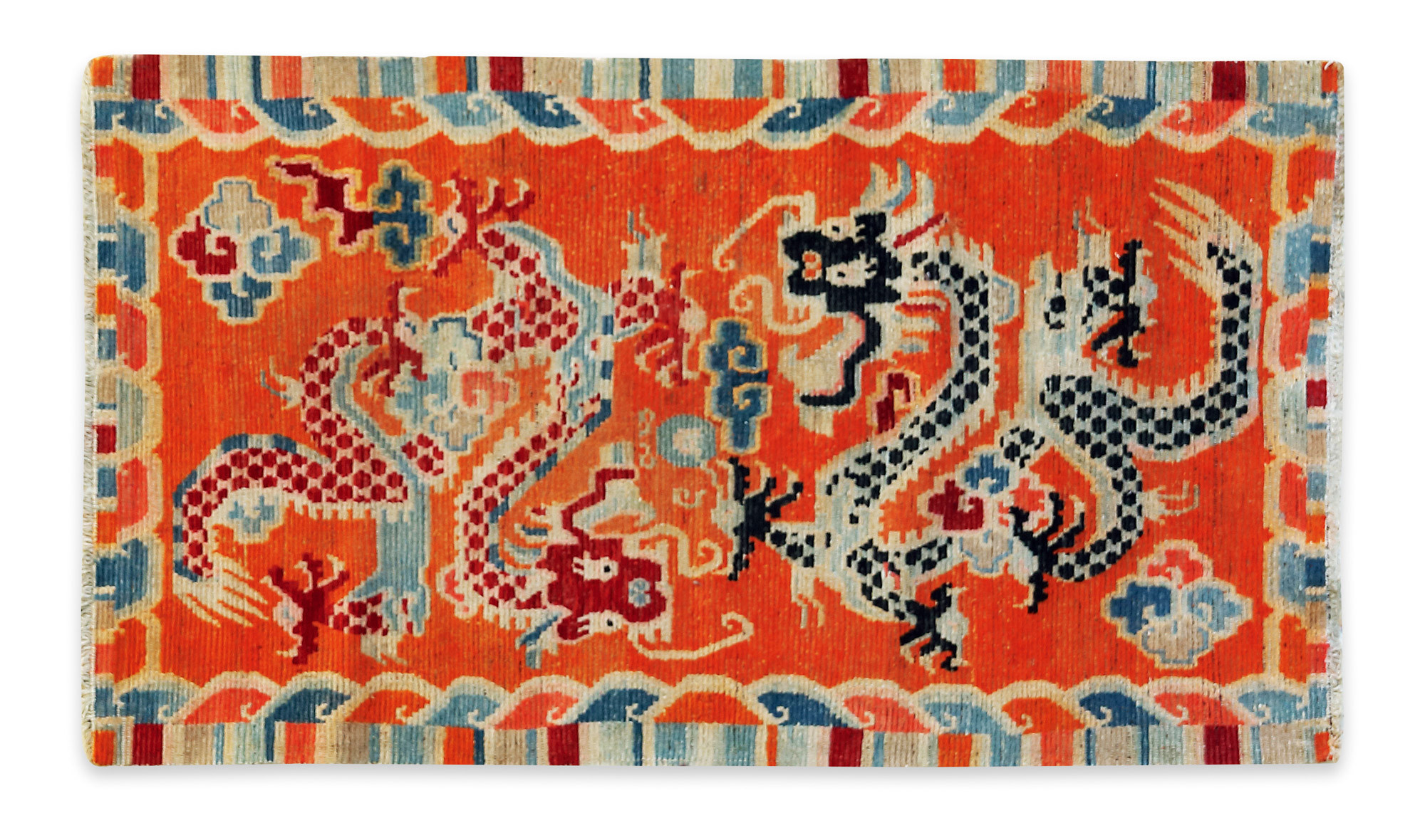 A RED GROUNDED ‘DRAGONS CHASING PEARL’ CARPET