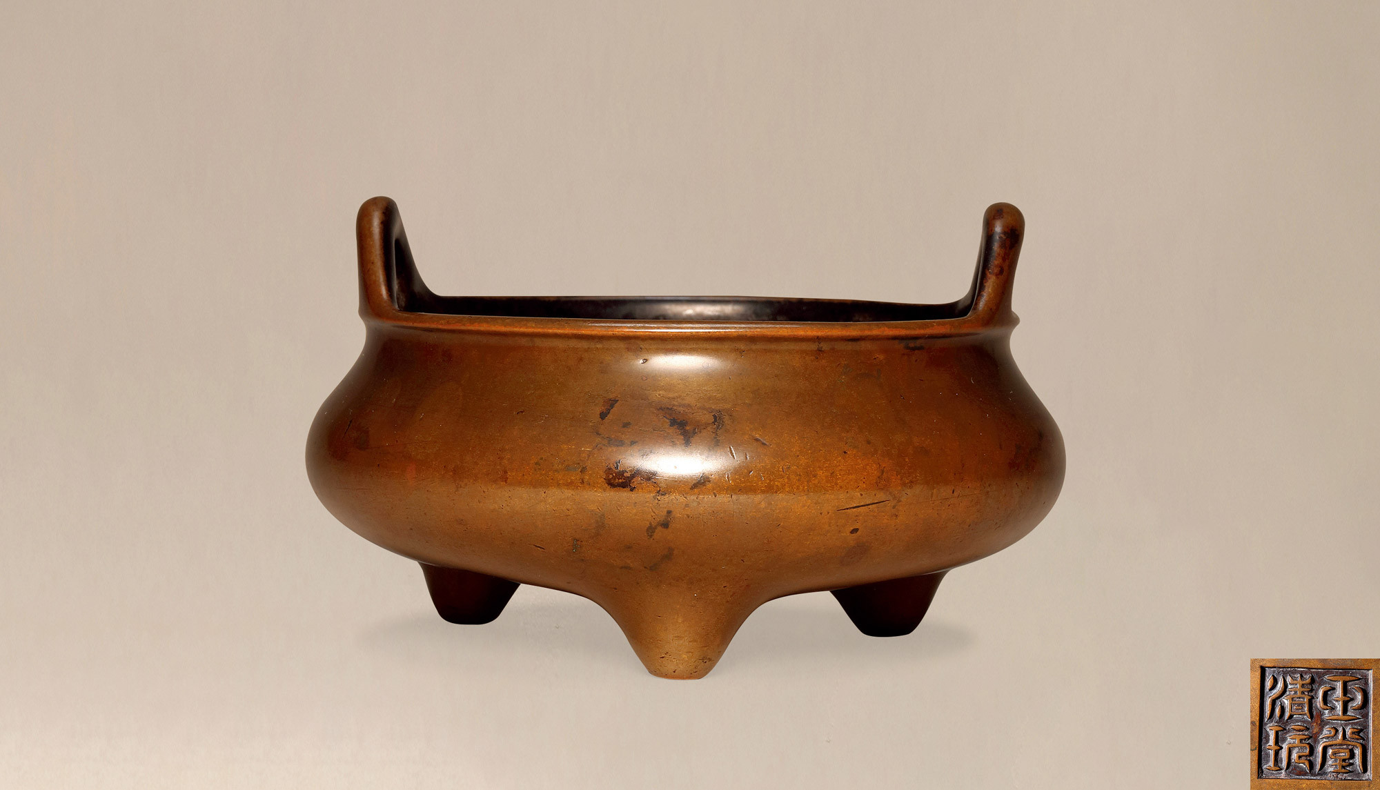 A RARE BRONZE CENSER WITH UPRIGHT LOOP HANDLES