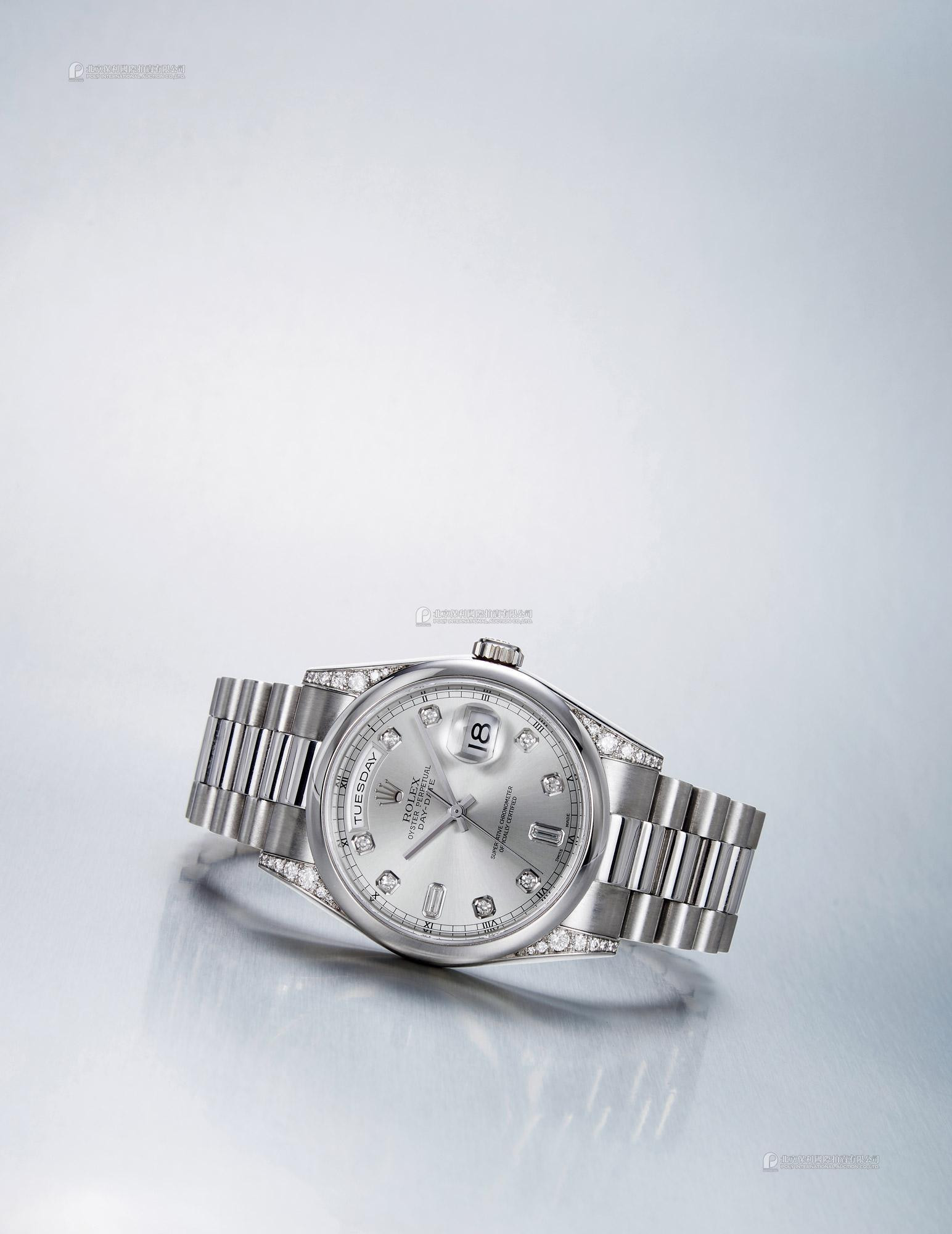 ROLEX A PLATINUM AND DIAMOND-SET AUTOMATIC WRISTWATCH WITH WEEK AND DATE INDICATION