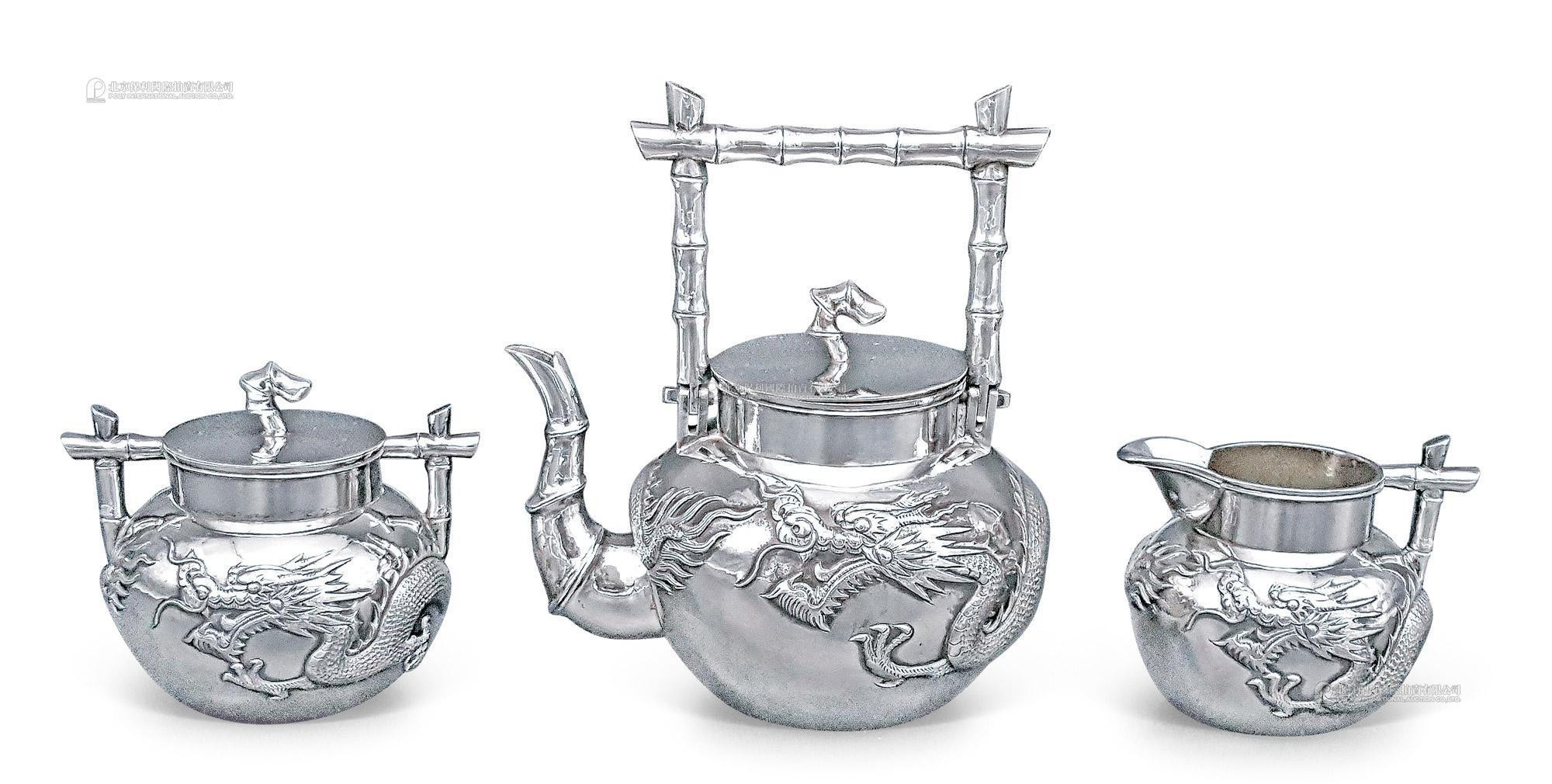 TUCK CHANG， A SET OF THREE-PIECE SILVER ‘RAMPANT DRAGON’ COFFEE AND TEA SERVICE WITH STYLISED BAMBOO HANDLE