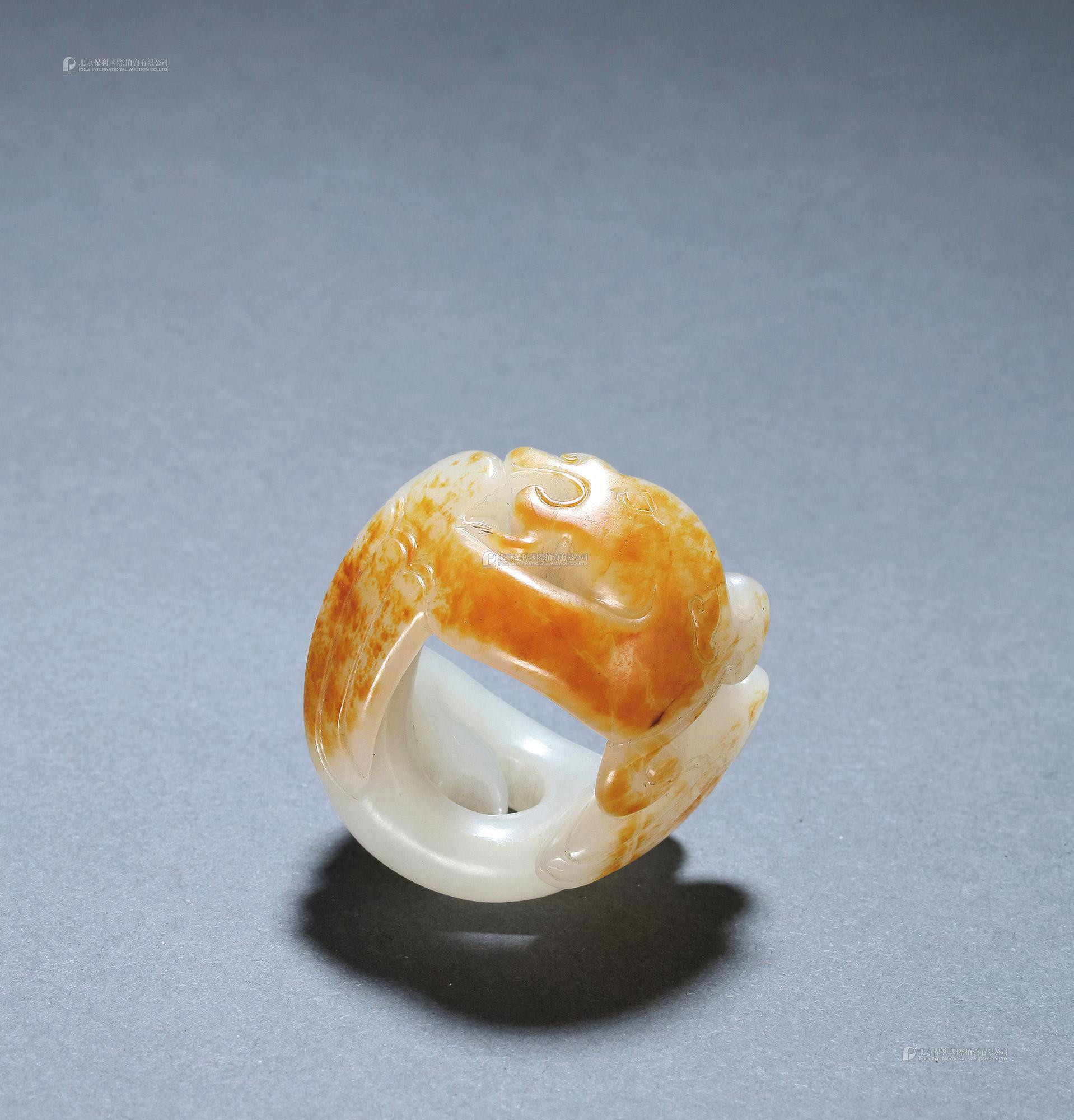 WHITE JADE CARVED THUMB RING WITH DESIGN OF DRAGON AND PHOENIX，SHE