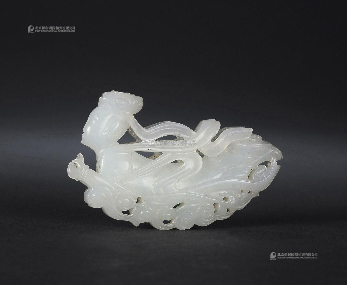 A CARVED WHITE JADE STATUE OF FLYING  APSARAS