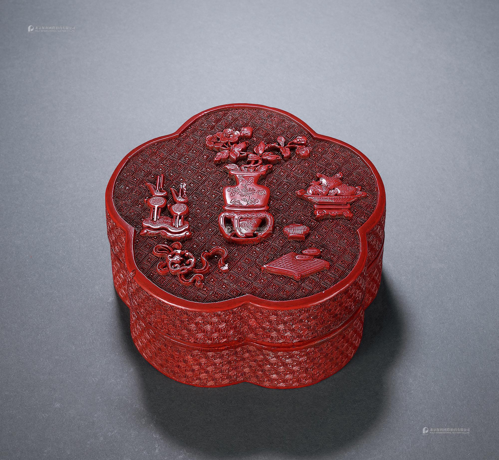 A CINNABAR LACQUER ‘PRECIOUS OBJECTS’ BOX WITH COVER